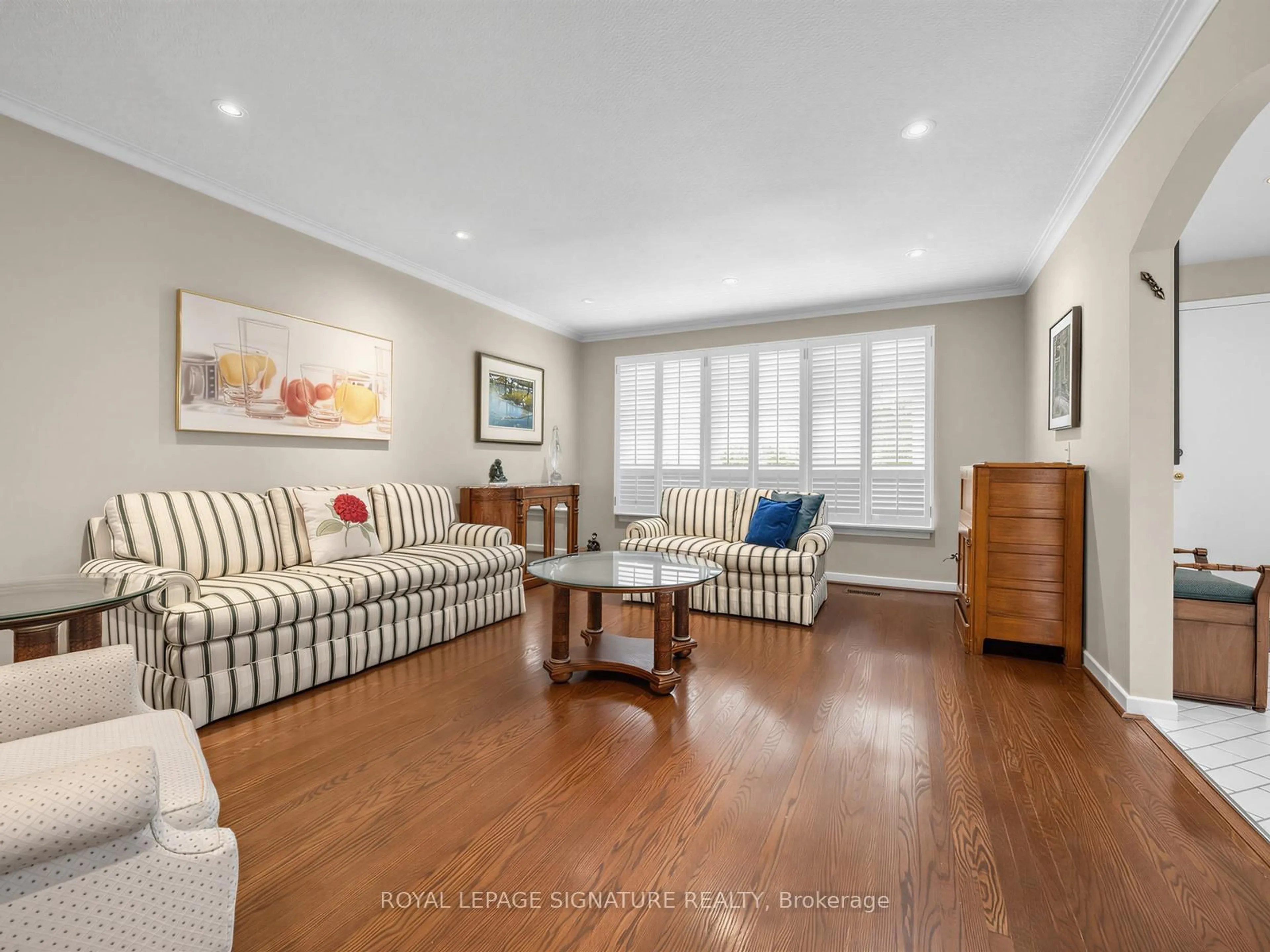 Living room with furniture, wood/laminate floor for 24 Rockland Dr, Toronto Ontario M2M 2Y9
