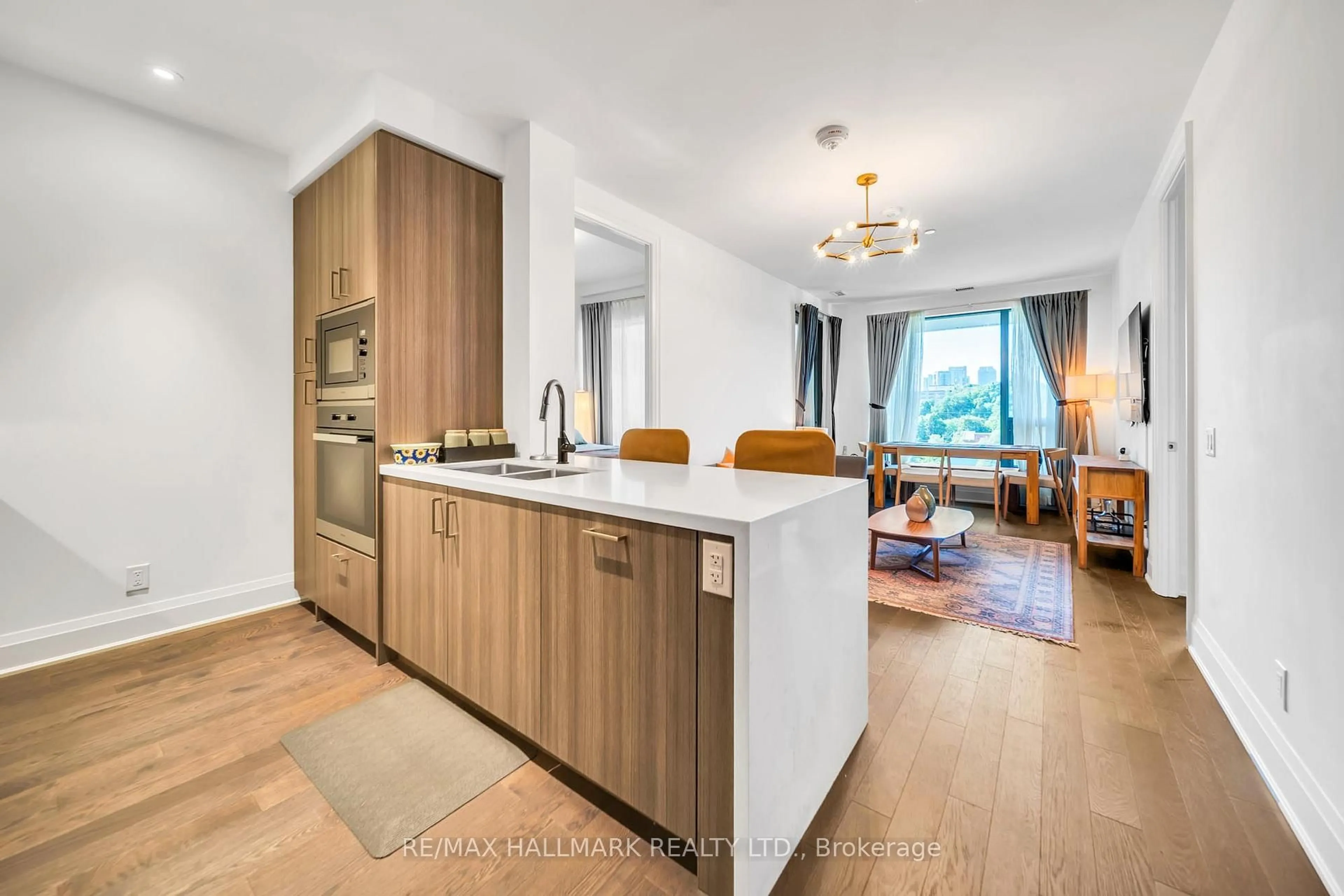 Open concept kitchen, wood/laminate floor for 280 Howland Ave #GPH22, Toronto Ontario M5R 0C3