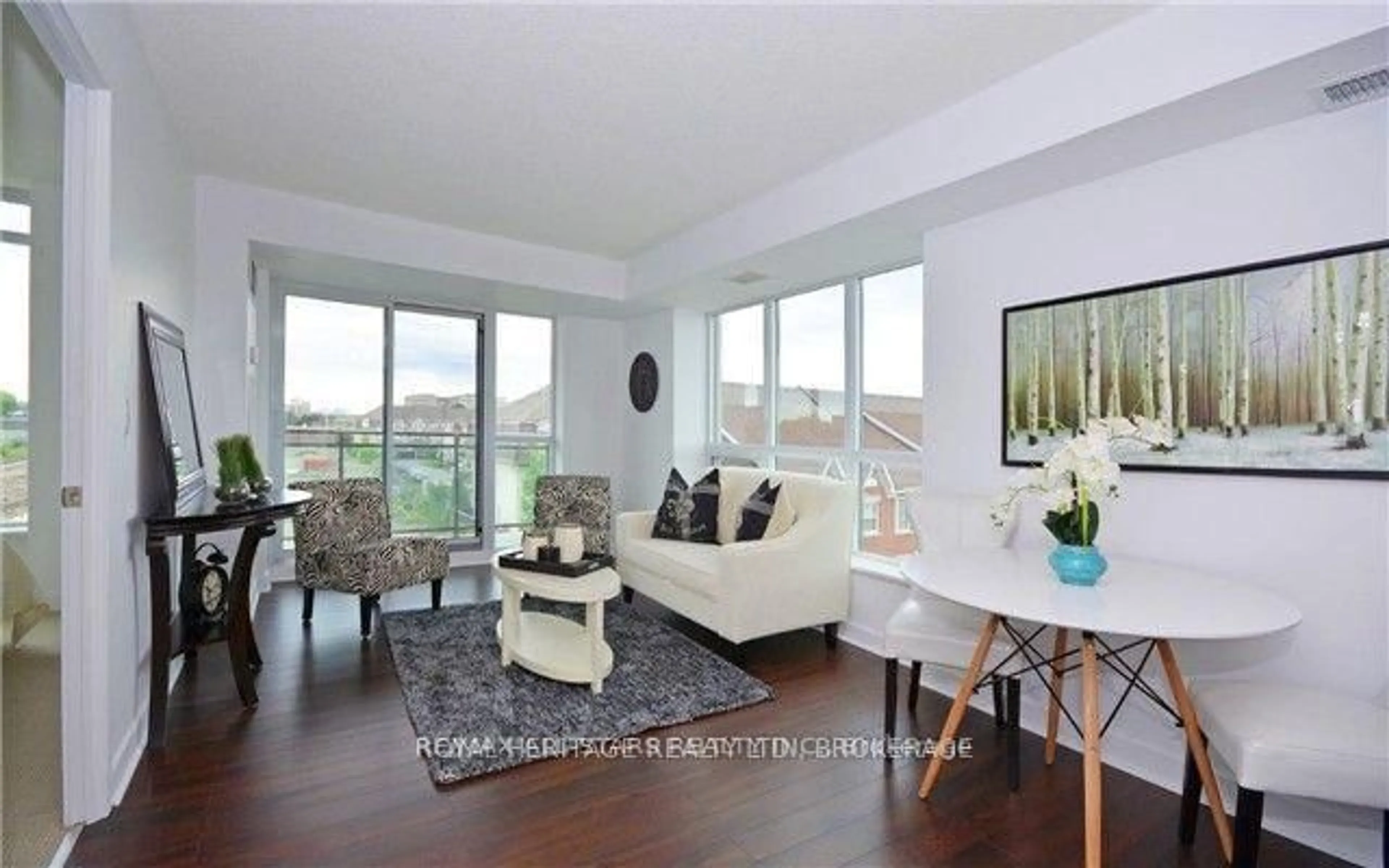 Living room with furniture, wood/laminate floor for 120 Dallimore Circ #424, Toronto Ontario M3C 4J1