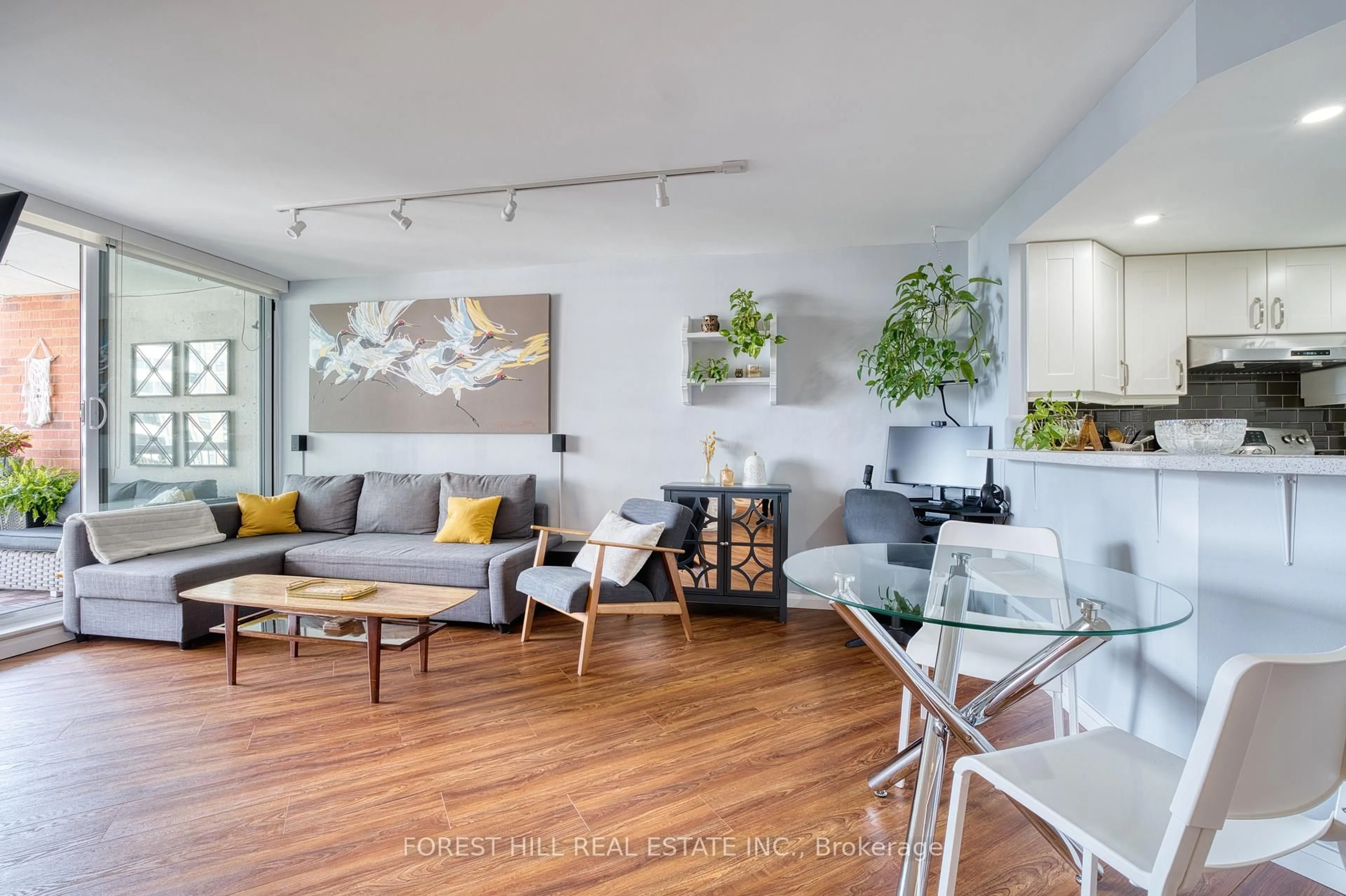 Living room with furniture, wood/laminate floor for 77 Maitland Pl #1904, Toronto Ontario M4Y 2V6
