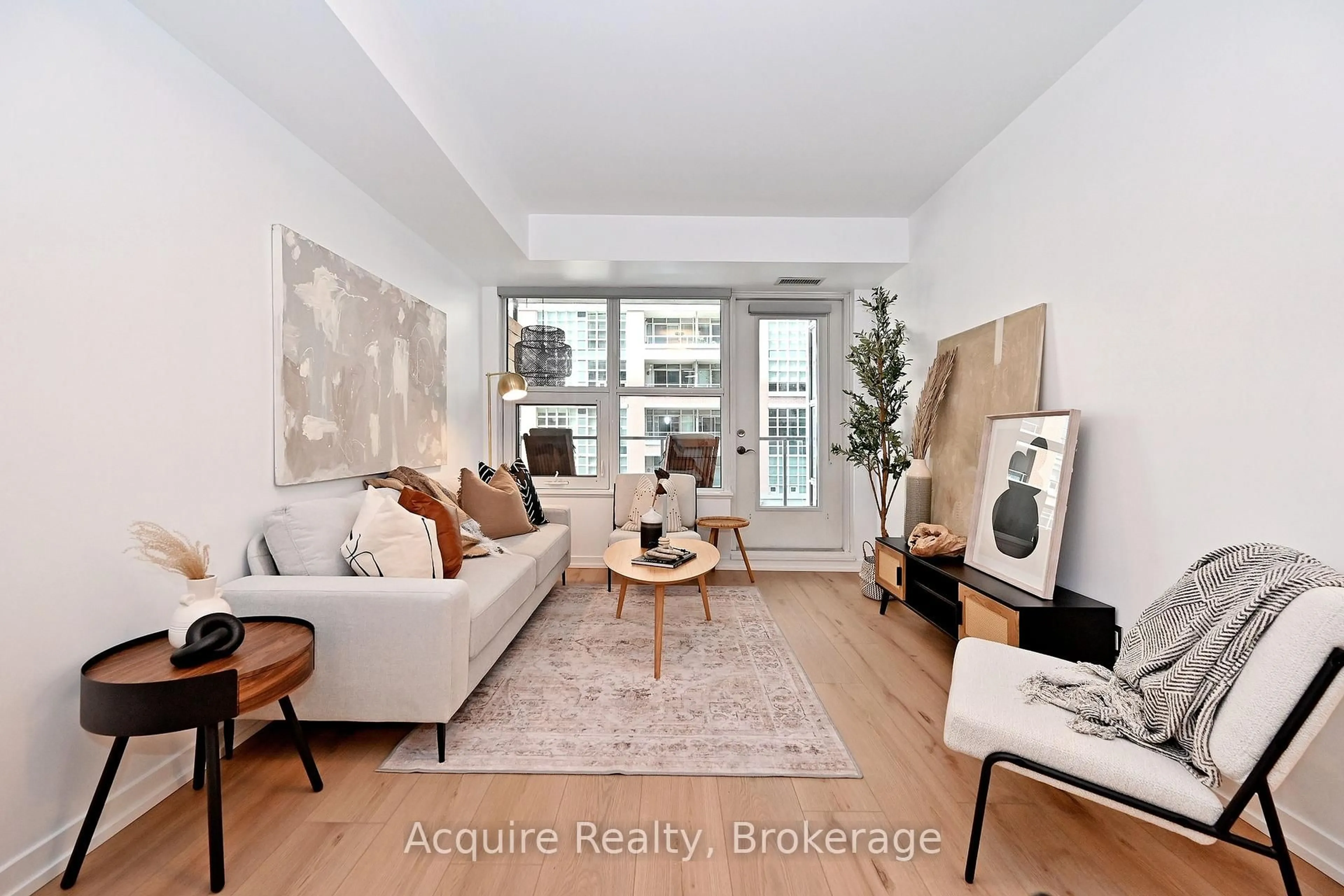 Living room with furniture, wood/laminate floor for 59 East Liberty St #308, Toronto Ontario M6K 3R1