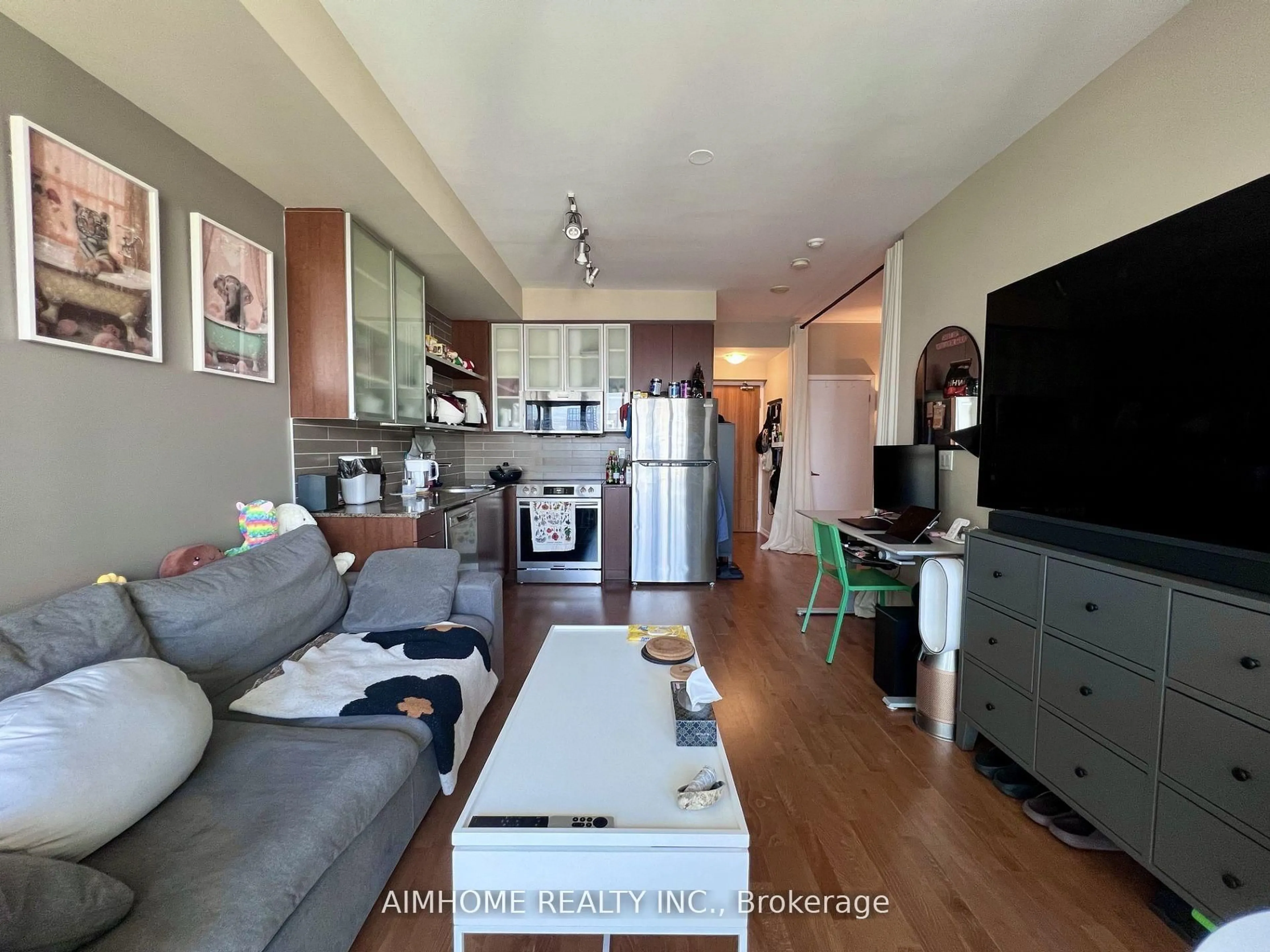 Living room with furniture, wood/laminate floor for 33 Lombard St #2505, Toronto Ontario M5C 3H8