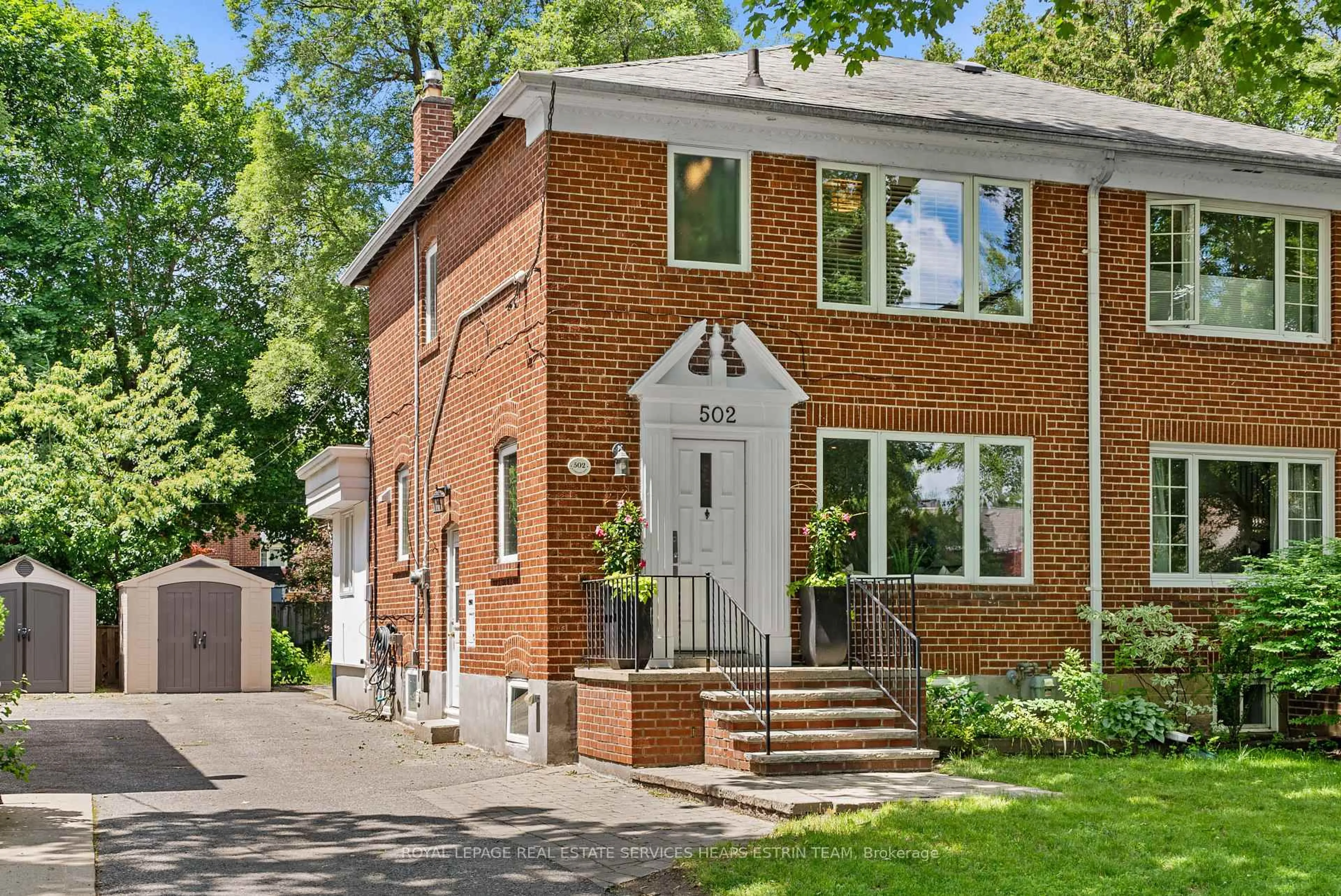 Home with brick exterior material, street for 502 Sutherland Dr, Toronto Ontario M4G 1K8