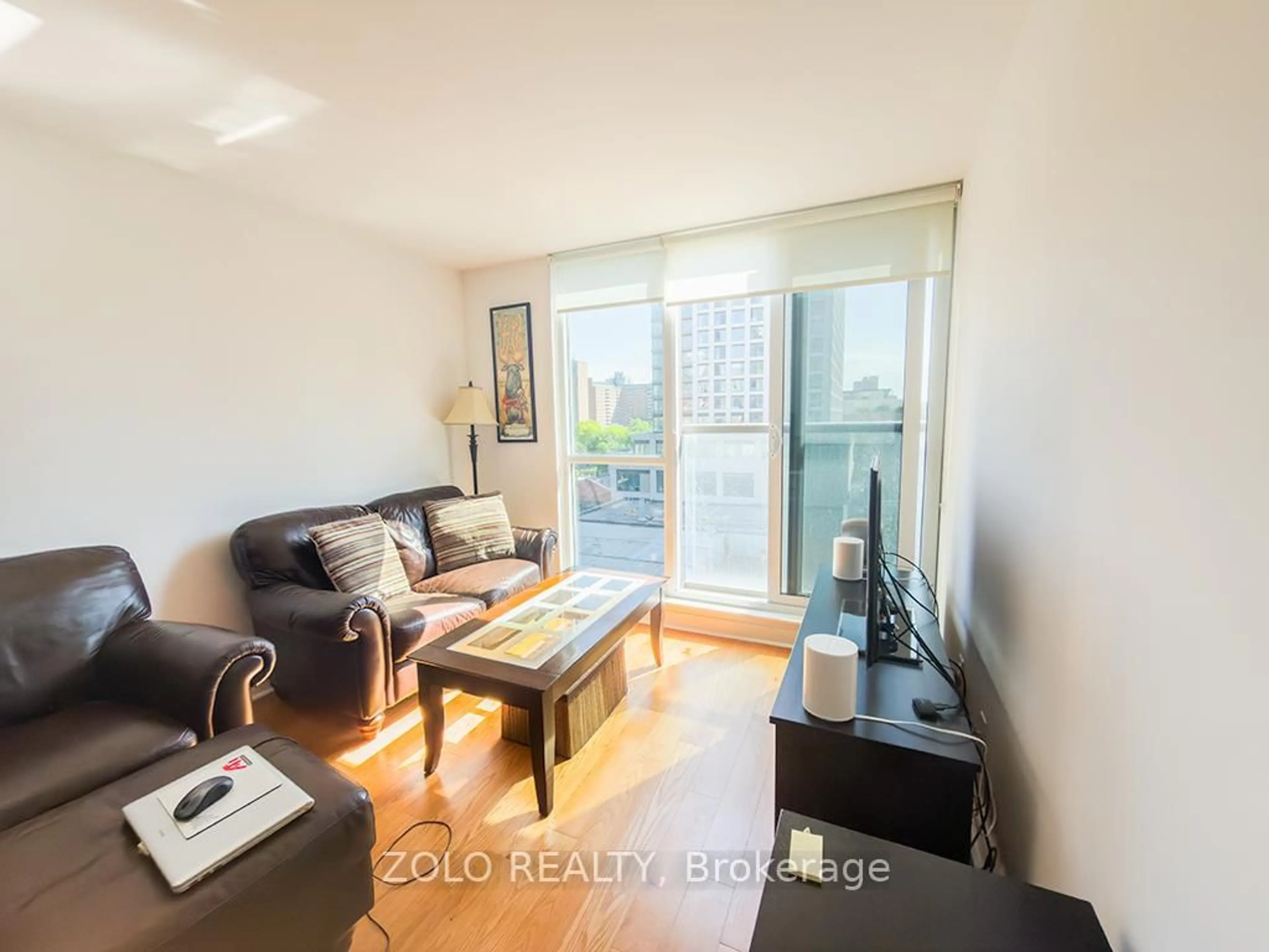 Living room with furniture, wood/laminate floor for 320 Richmond St #817, Toronto Ontario M5A 1P9