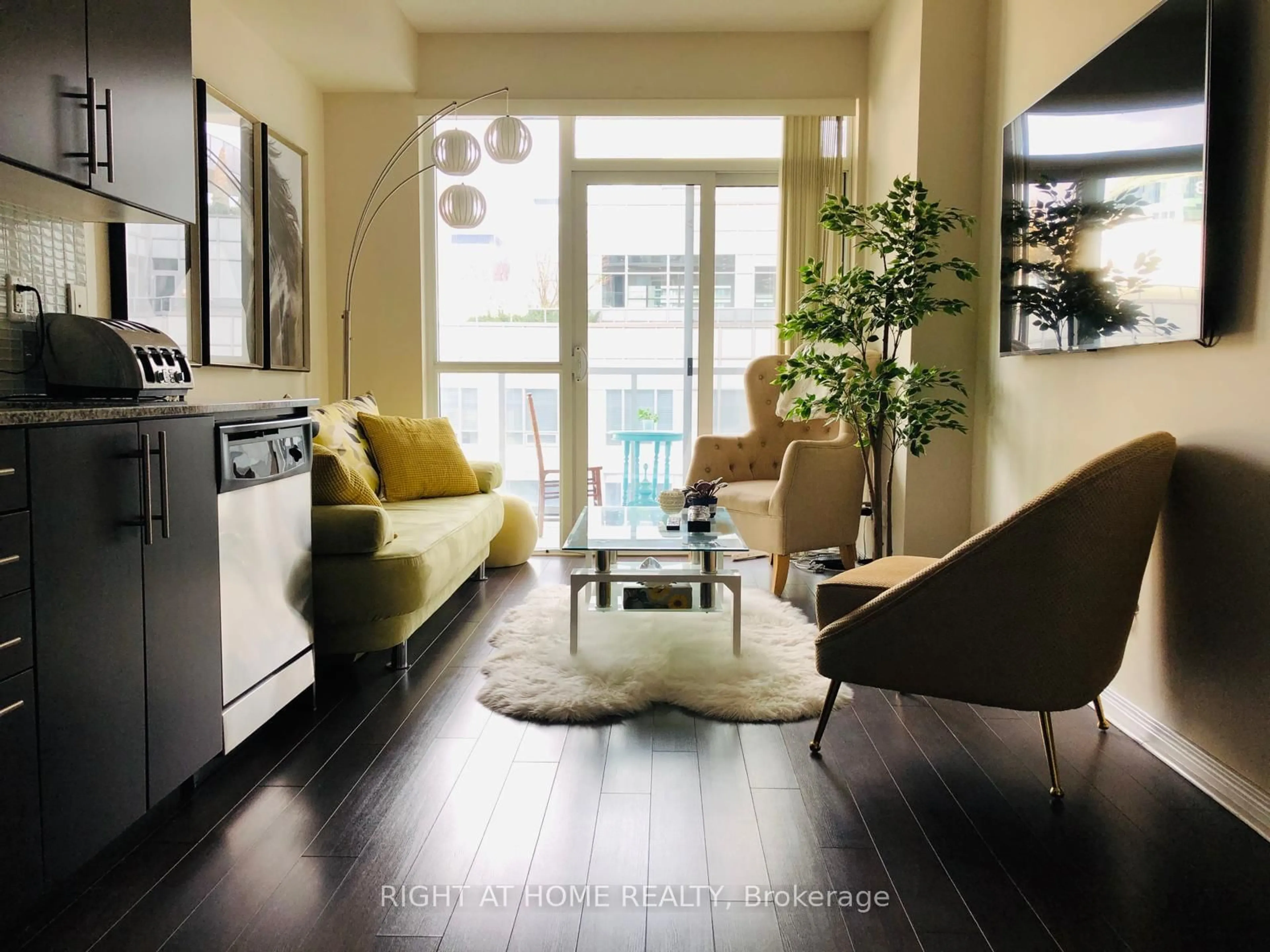 Living room with furniture, wood/laminate floor for 352 Front St #1918, Toronto Ontario M5V 0K3