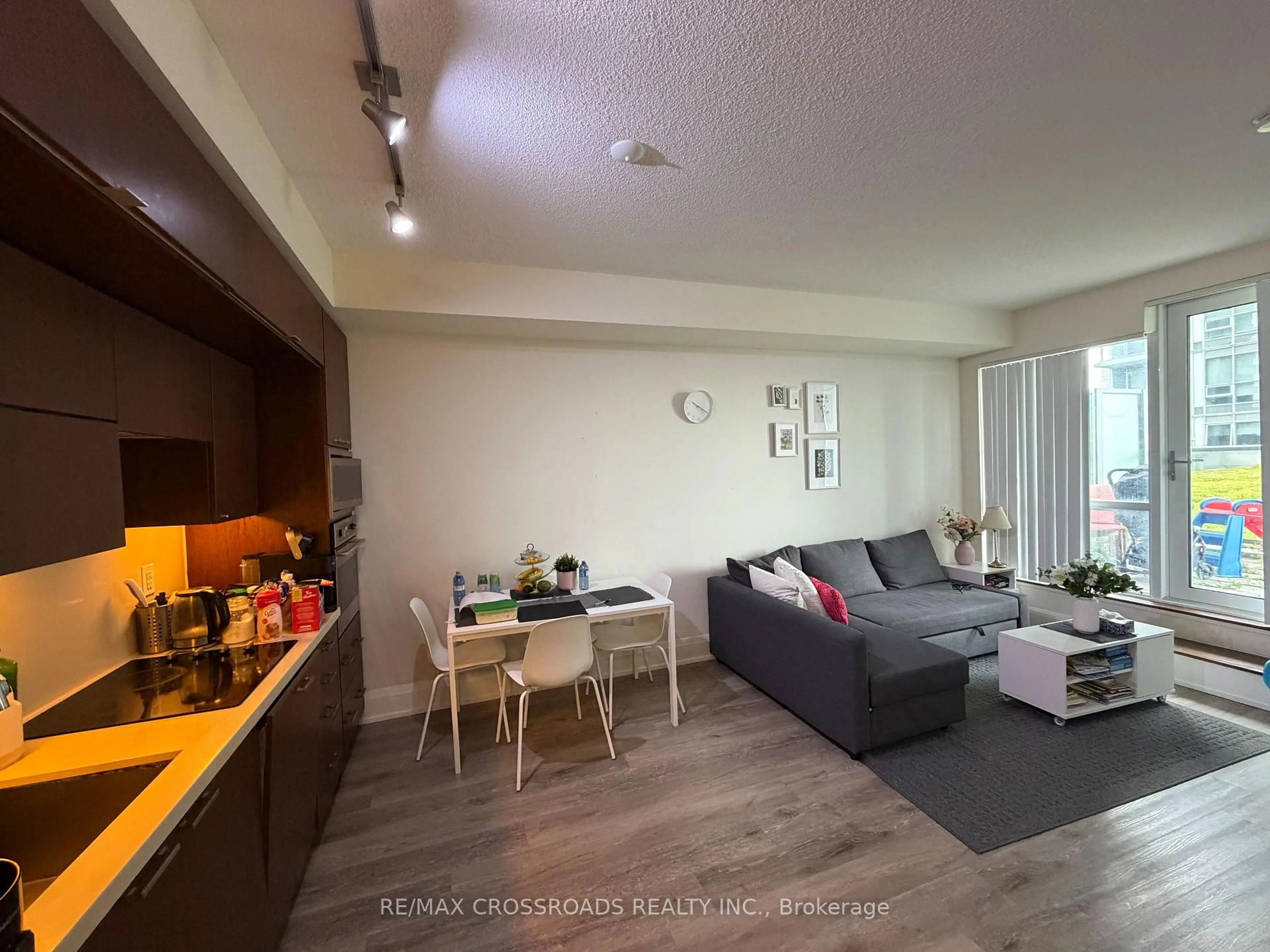Living room with furniture, wood/laminate floor for 120 Harrison Garden Blvd #902, Toronto Ontario M2N 0H1