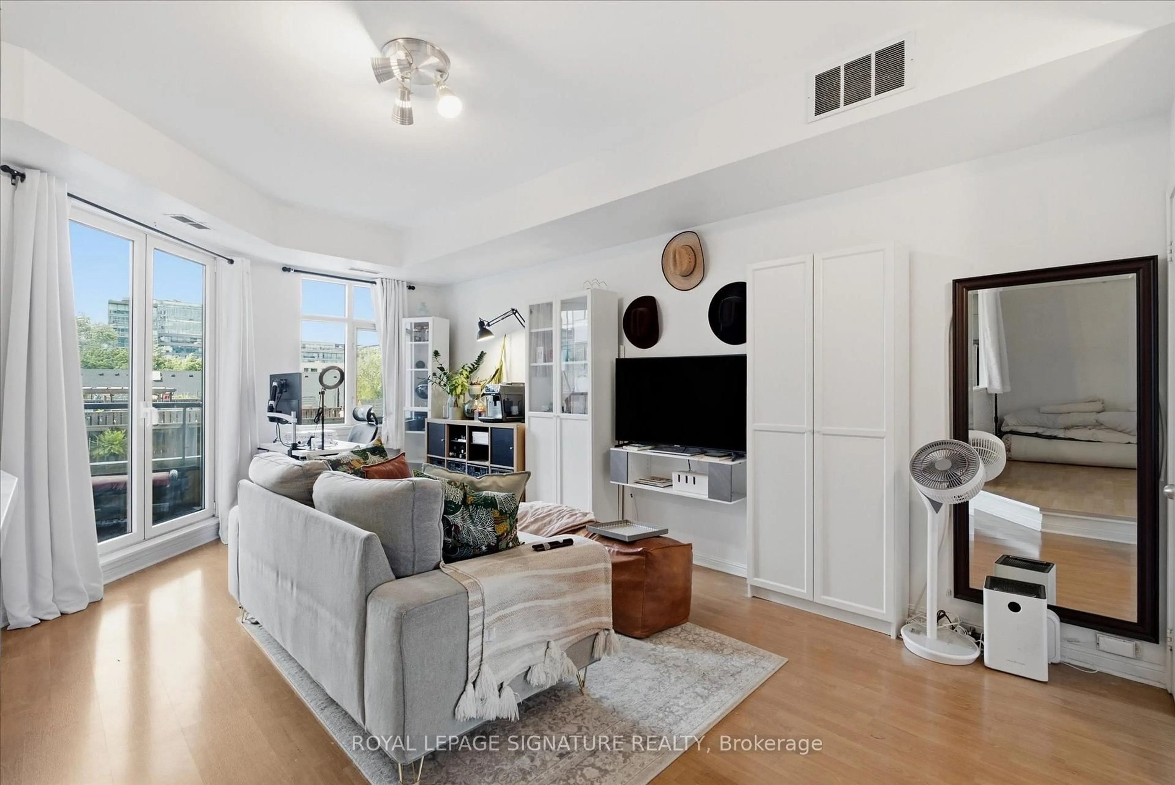 Living room with furniture, floor is not visible for 550 Front St #413, Toronto Ontario M5V 3N5