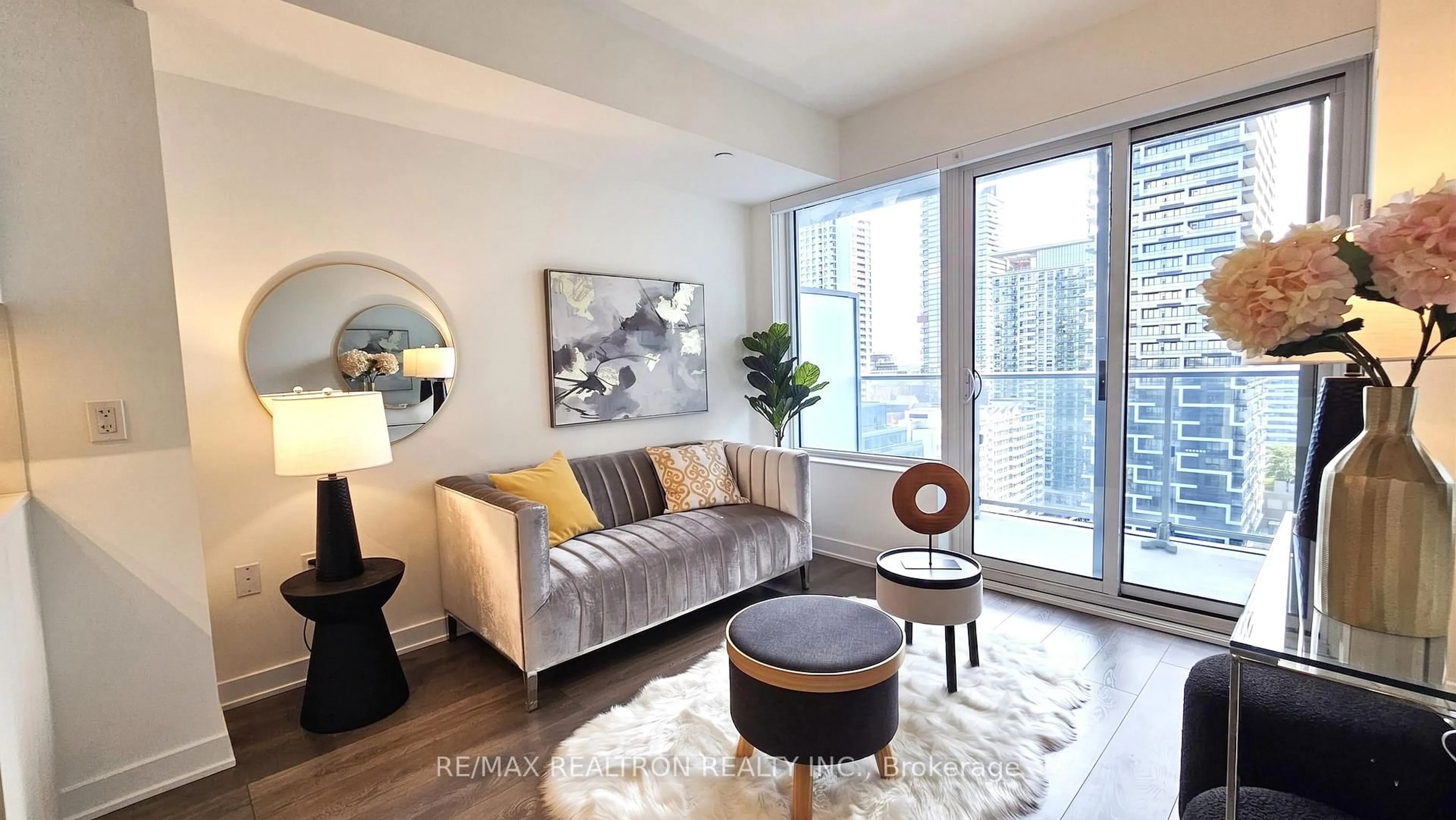 Living room with furniture, wood/laminate floor for 195 Redpath Ave #2111, Toronto Ontario M4P 0E4