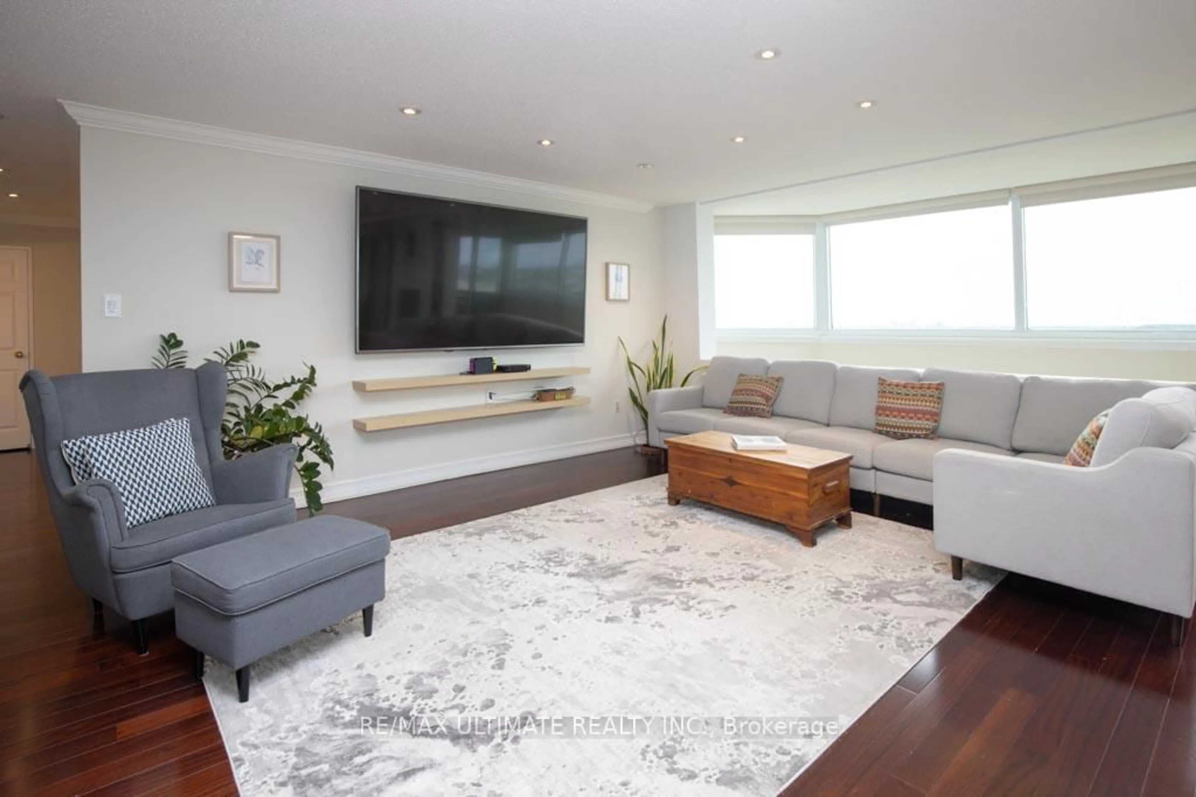 Living room with furniture, wood/laminate floor for 75 Wynford Heights Cres #2504, Toronto Ontario M3C 3H9