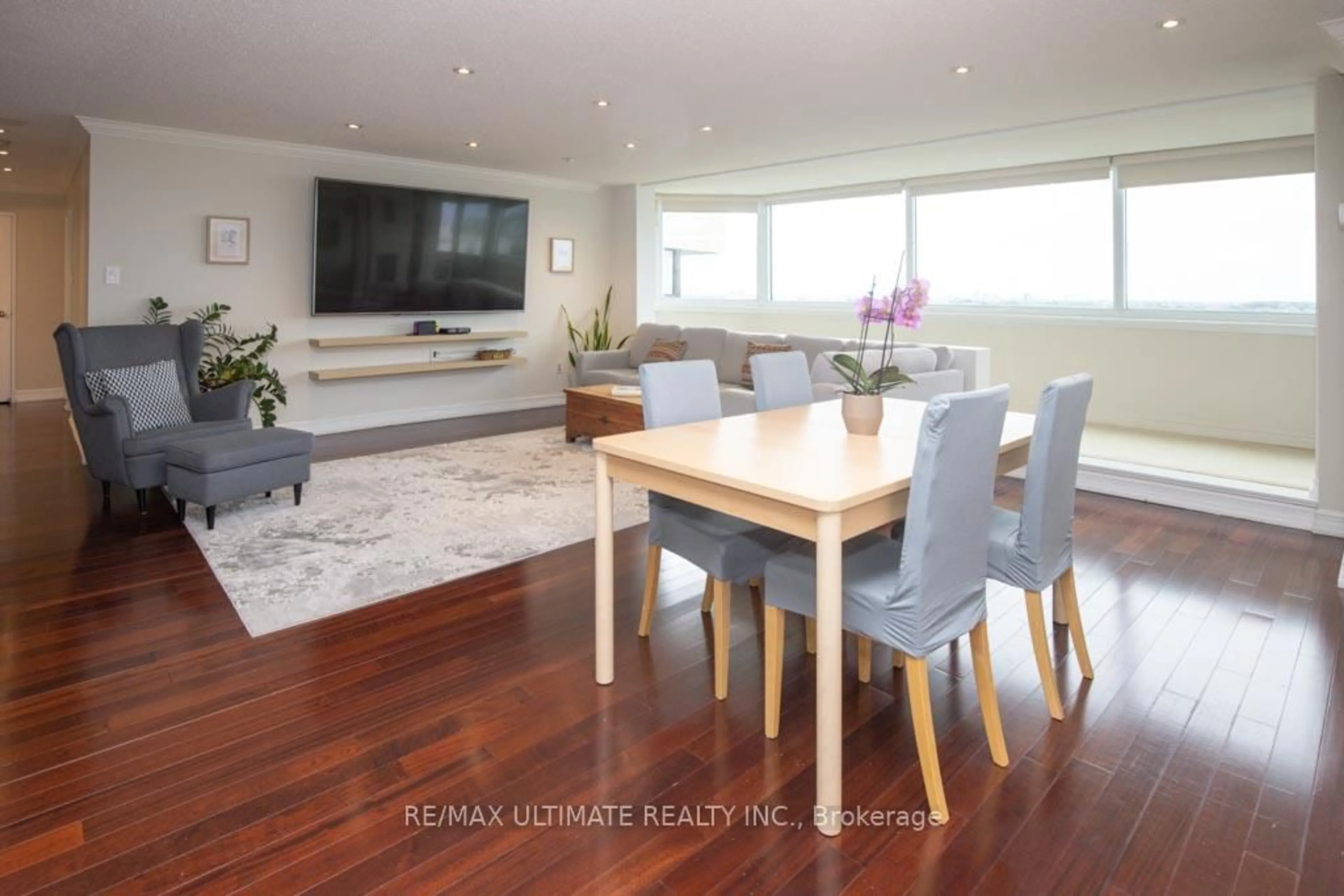Living room with furniture, wood/laminate floor for 75 Wynford Heights Cres #2504, Toronto Ontario M3C 3H9