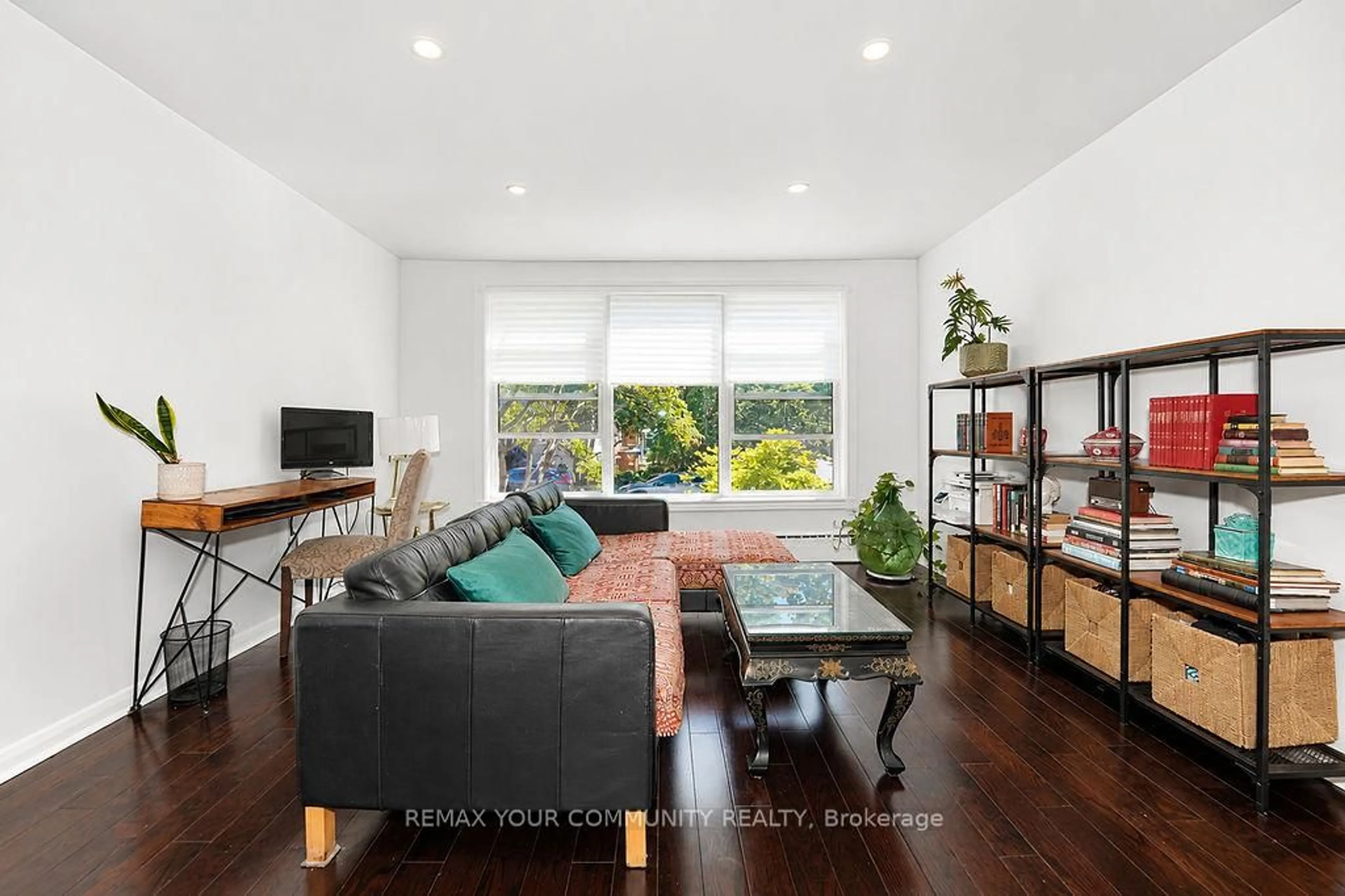 Living room with furniture, wood/laminate floor for 2 Rowley Ave, Toronto Ontario M4P 2S8