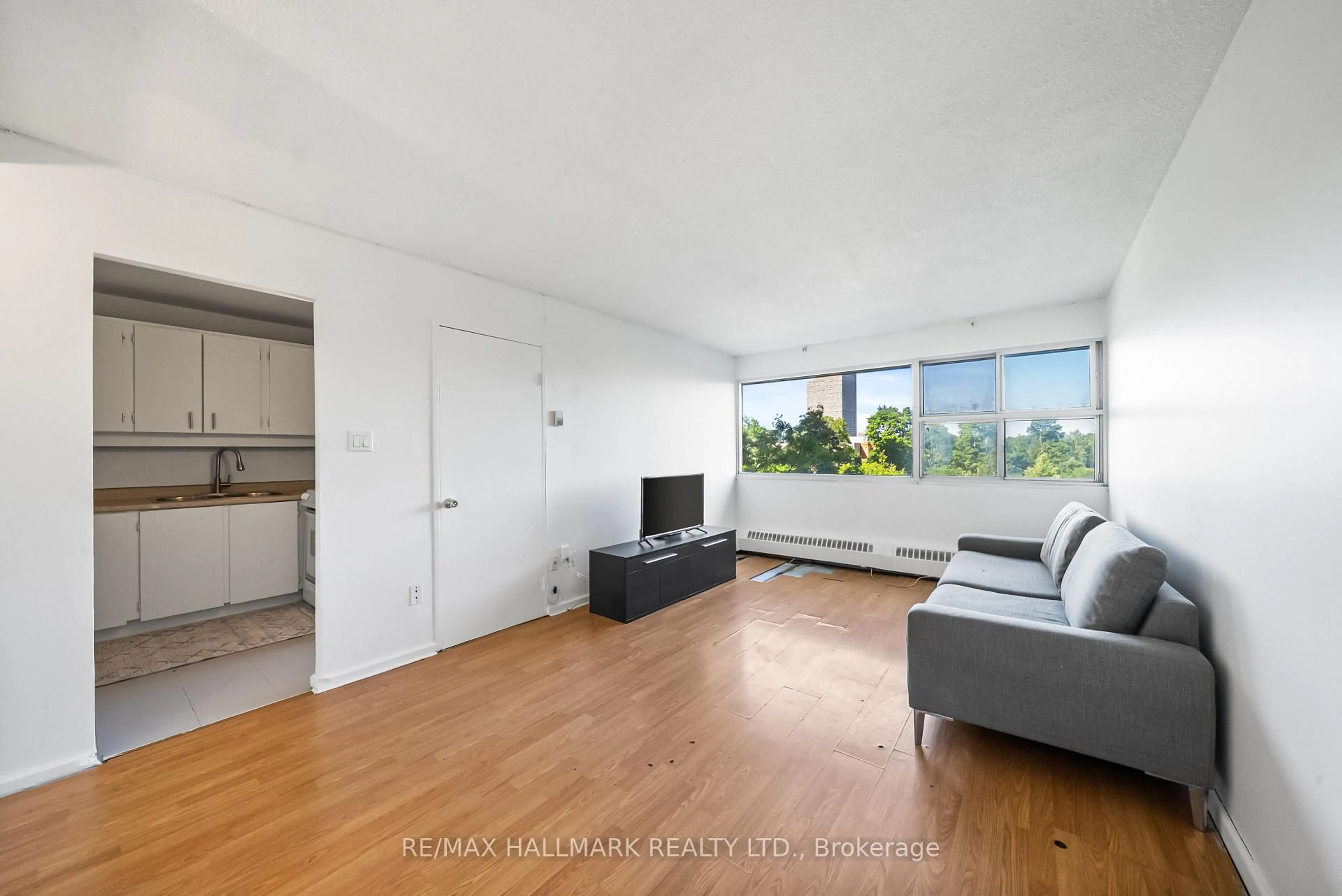 Living room with furniture, unknown for 725 Don Mills Rd #304, Toronto Ontario M3C 1S6