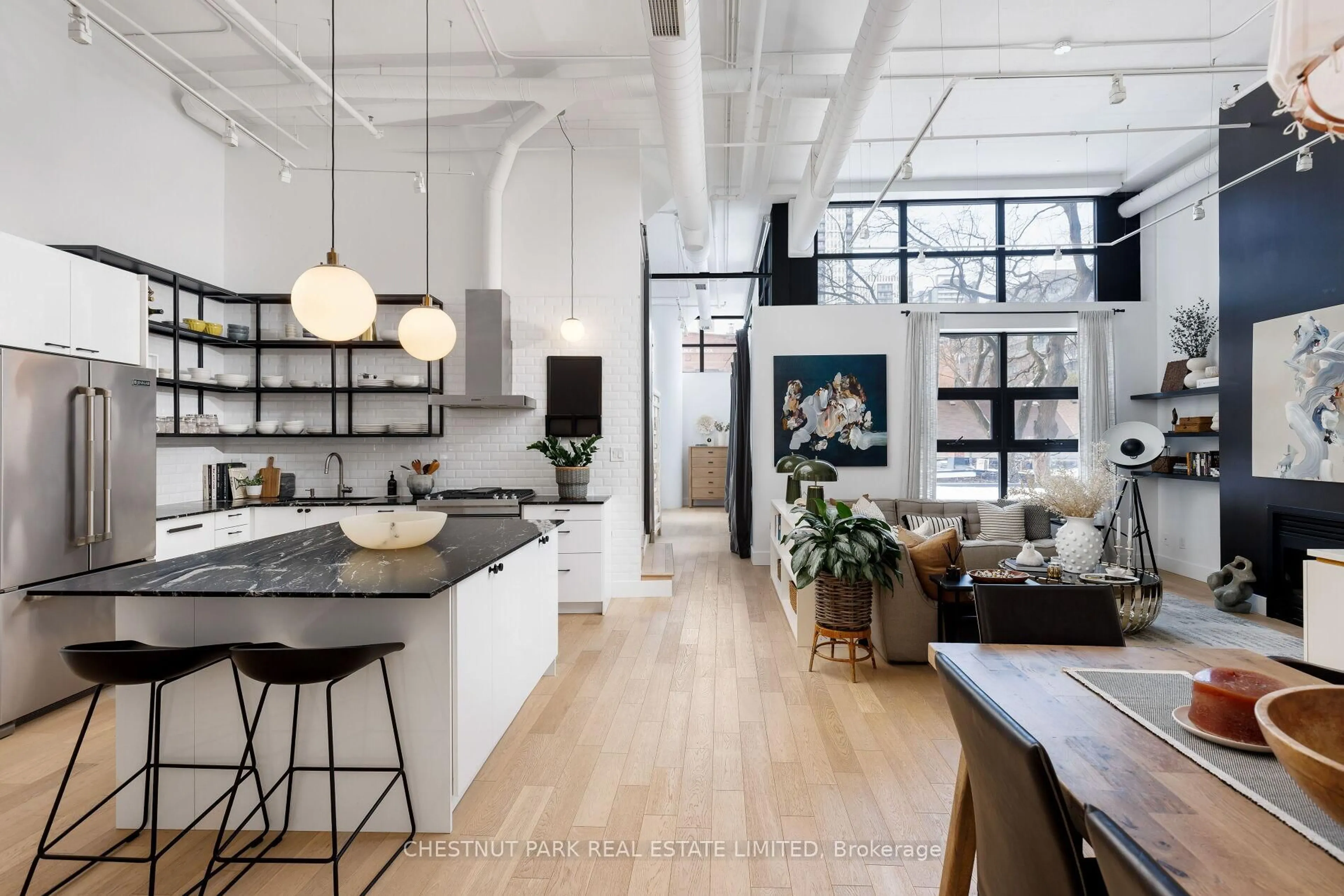 Open concept kitchen, cement floor for 90 Sumach St #313, Toronto Ontario M5A 4R4