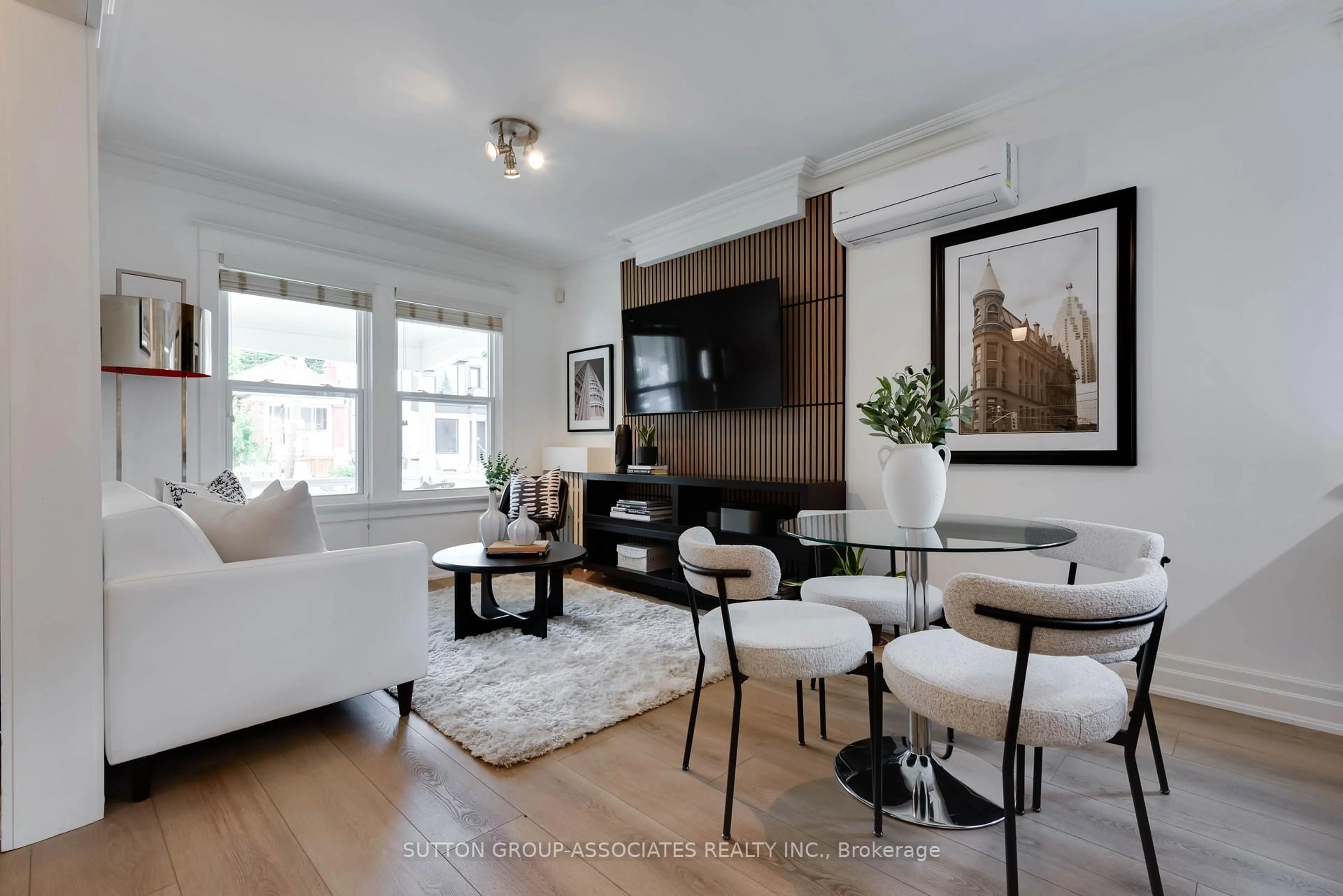 Living room with furniture, wood/laminate floor for 270 Robina Ave, Toronto Ontario M6C 3Z1