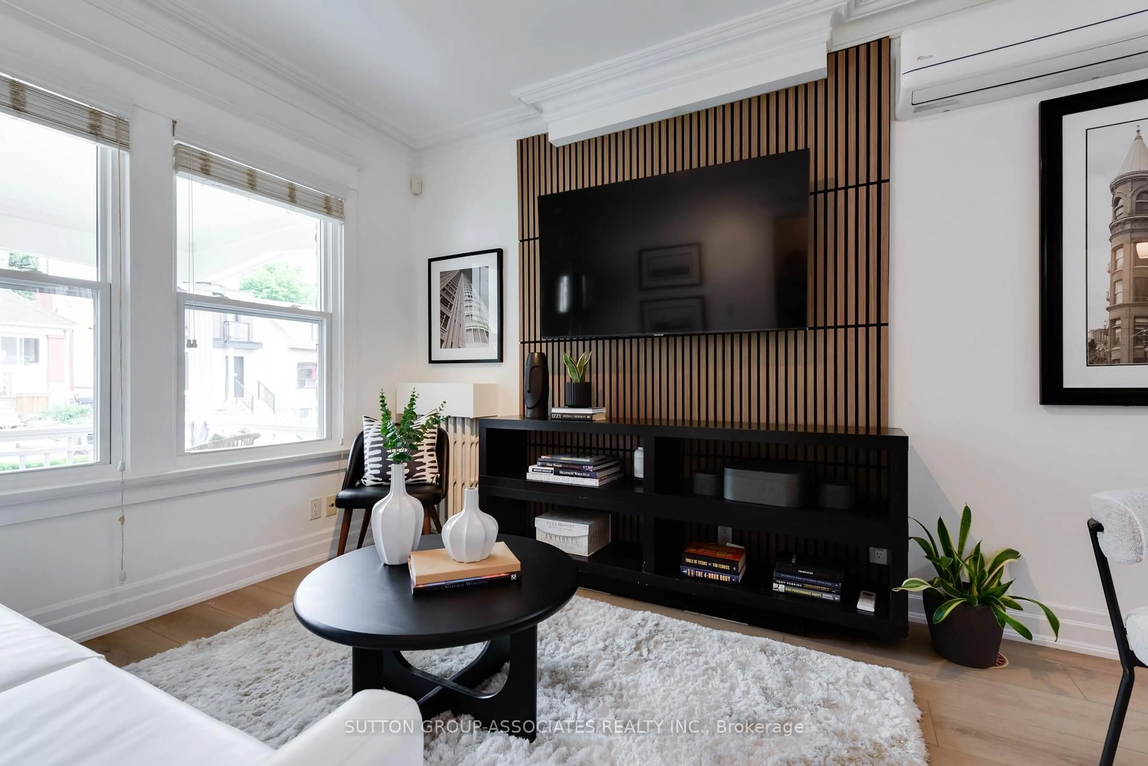 Living room with furniture, wood/laminate floor for 270 Robina Ave, Toronto Ontario M6C 3Z1
