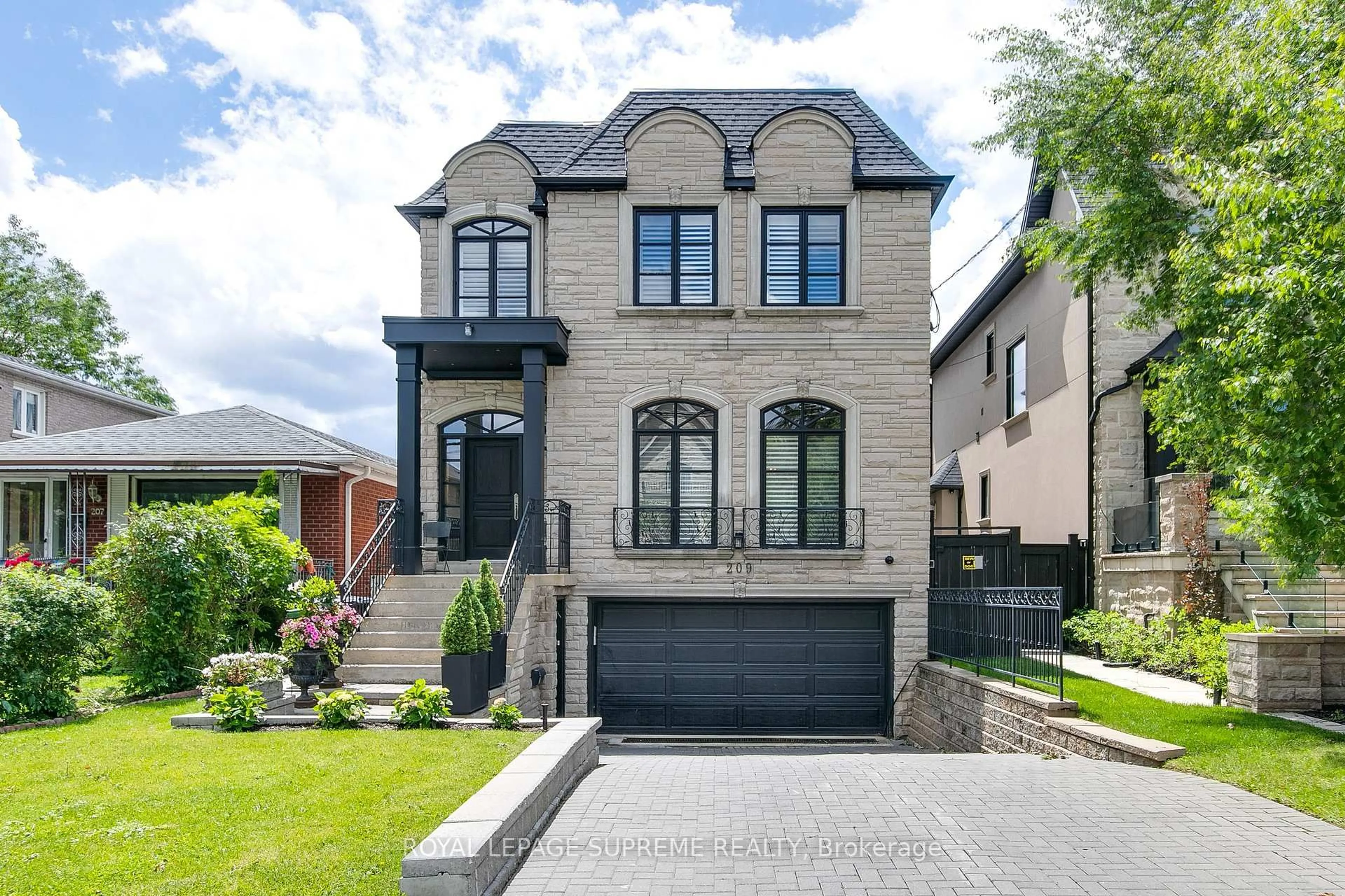Home with brick exterior material, street for 209 Carmichael Ave, Toronto Ontario M5M 2X2