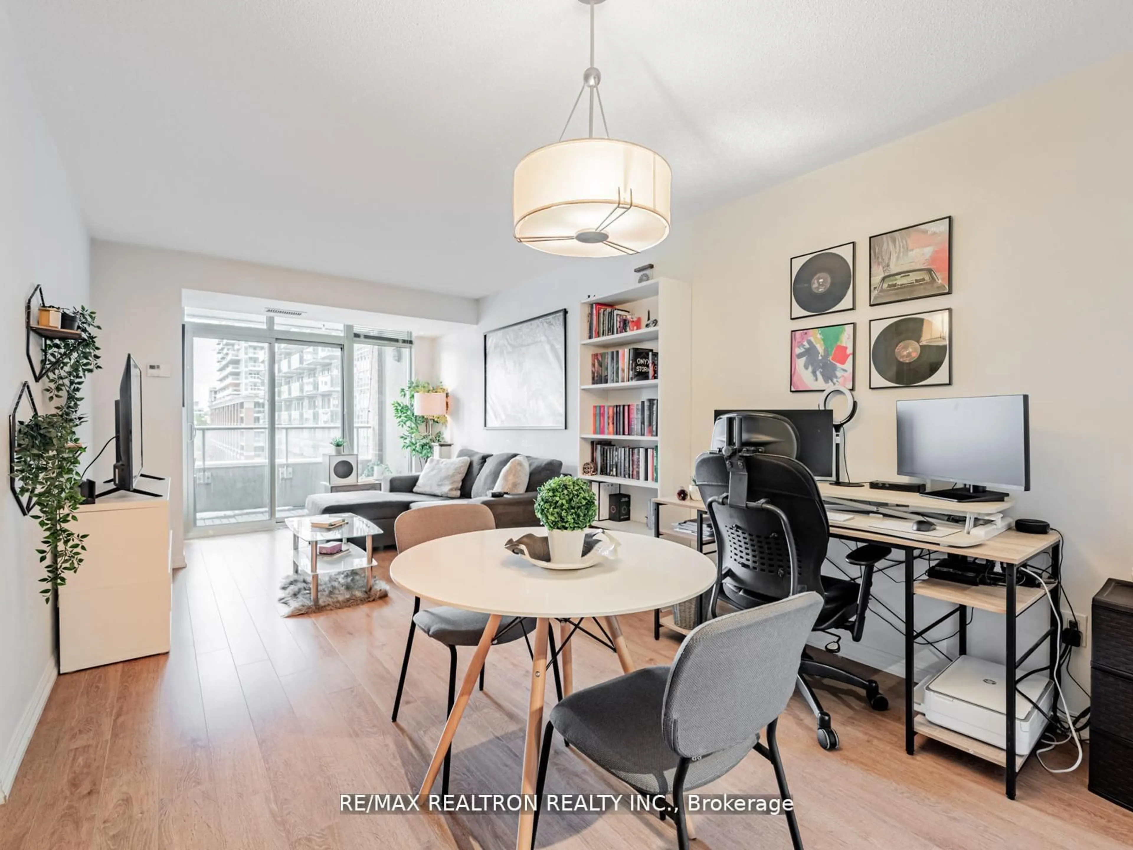 Living room with furniture, wood/laminate floor for 85 East Liberty St #716, Toronto Ontario M6K 3R4