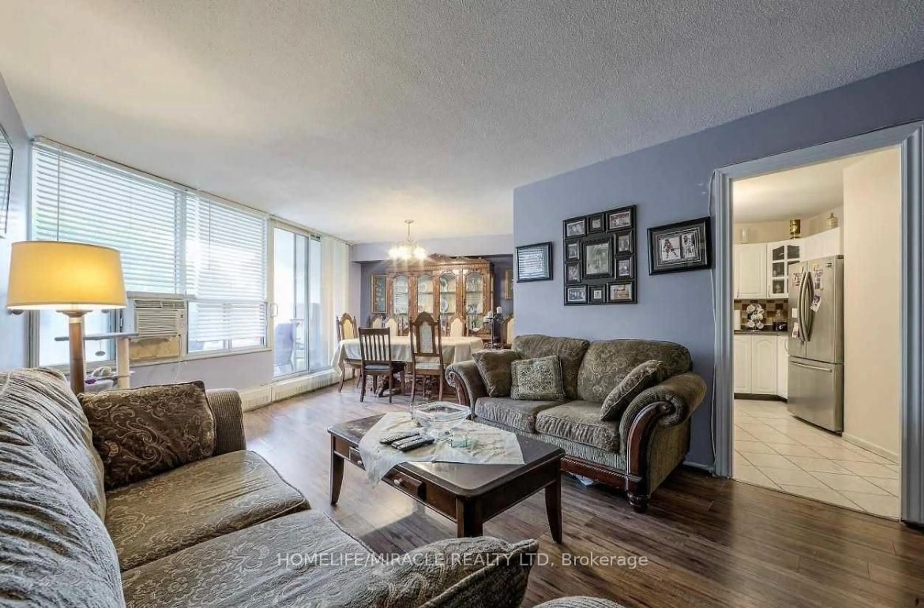 Living room with furniture, unknown for 60 Pavane Linkway #216, Toronto Ontario M3C 1A1
