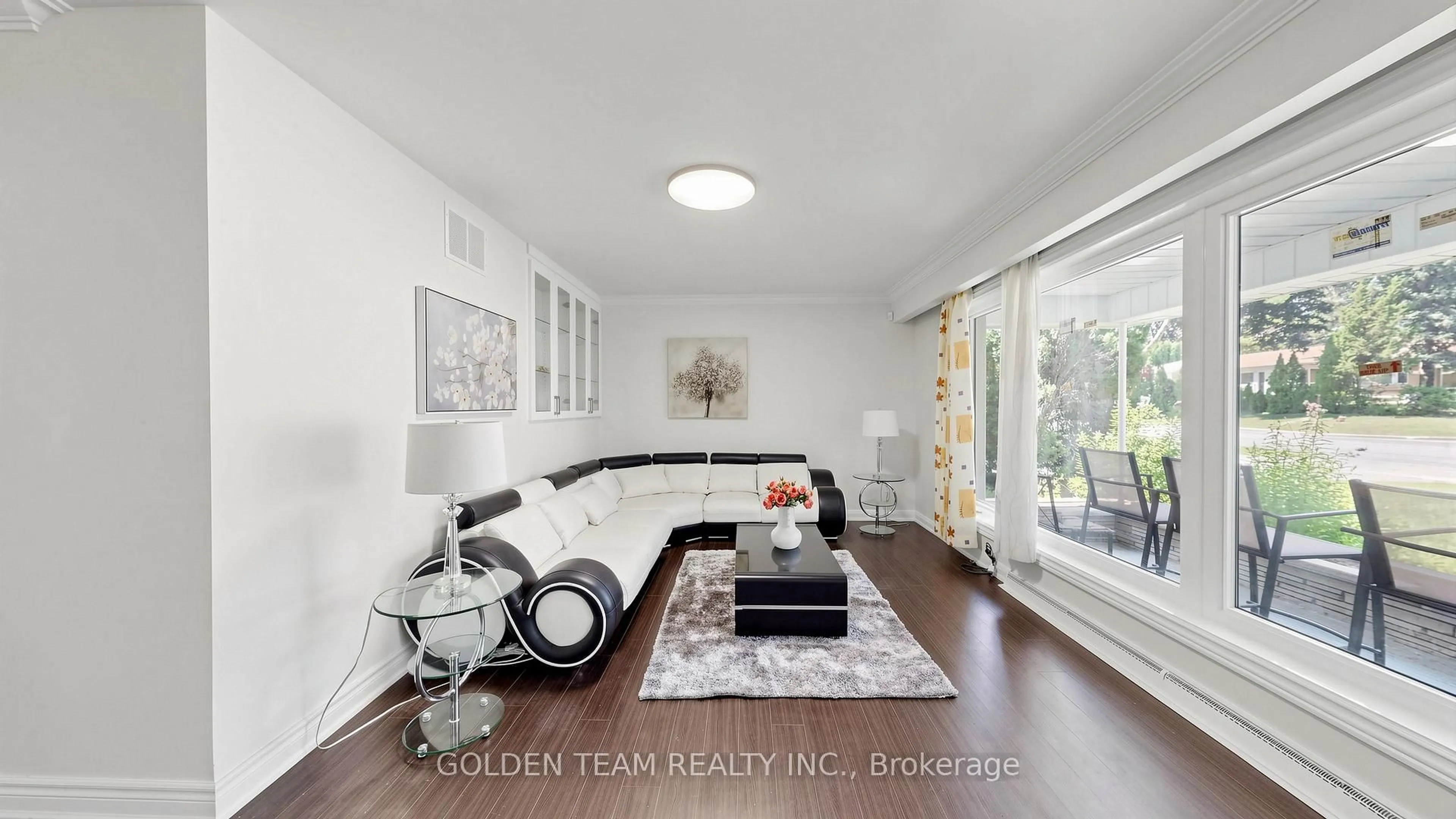 Living room with furniture, wood/laminate floor for 67 Burbank Dr, Toronto Ontario M2K 1N3
