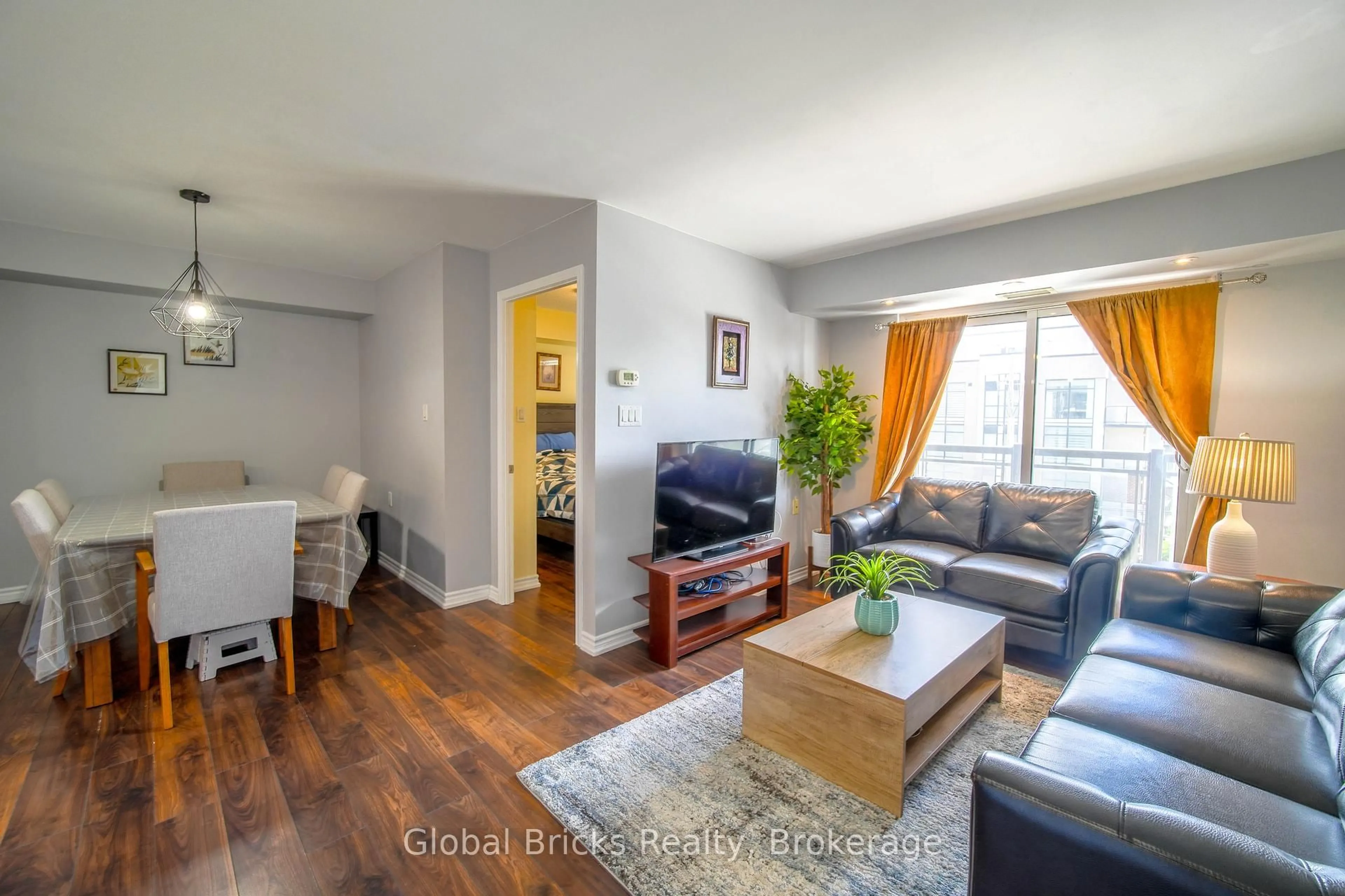 Living room with furniture, wood/laminate floor for 872 Sheppard Ave #308, Toronto Ontario M3H 2T5