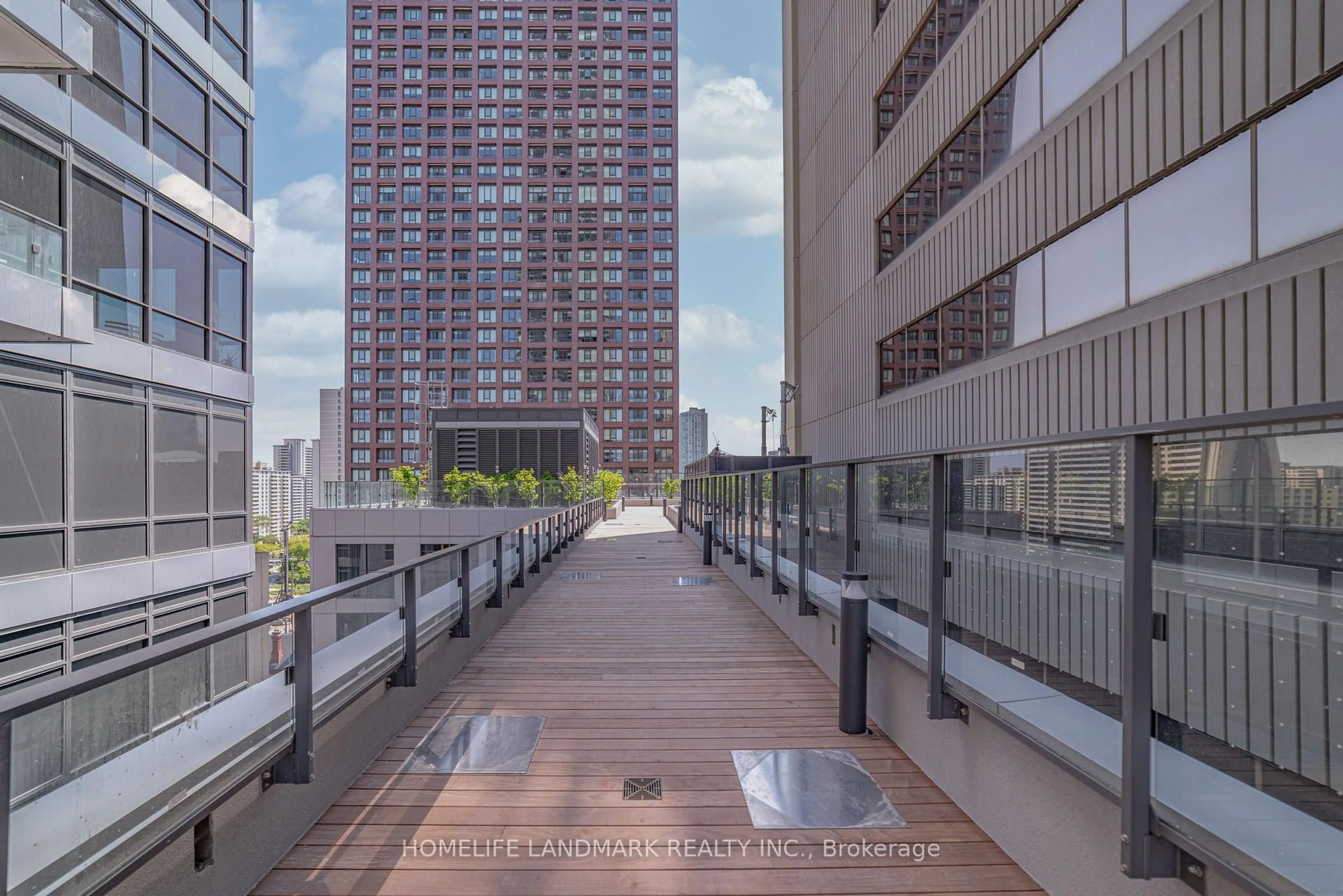 Patio, city buildings view from balcony for 395 Bloor St #5001, Toronto Ontario M4W 0B4