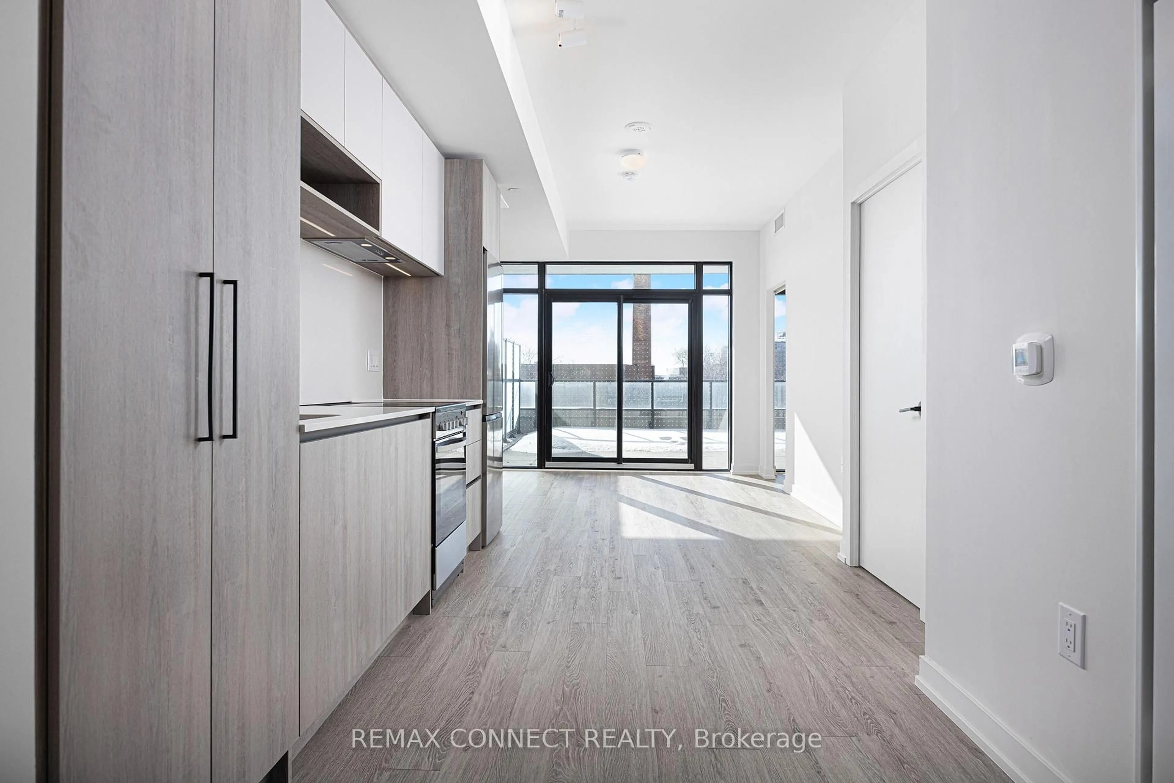 Open concept kitchen, cement floor for 181 Sterling Rd #303, Toronto Ontario M6R 2B2