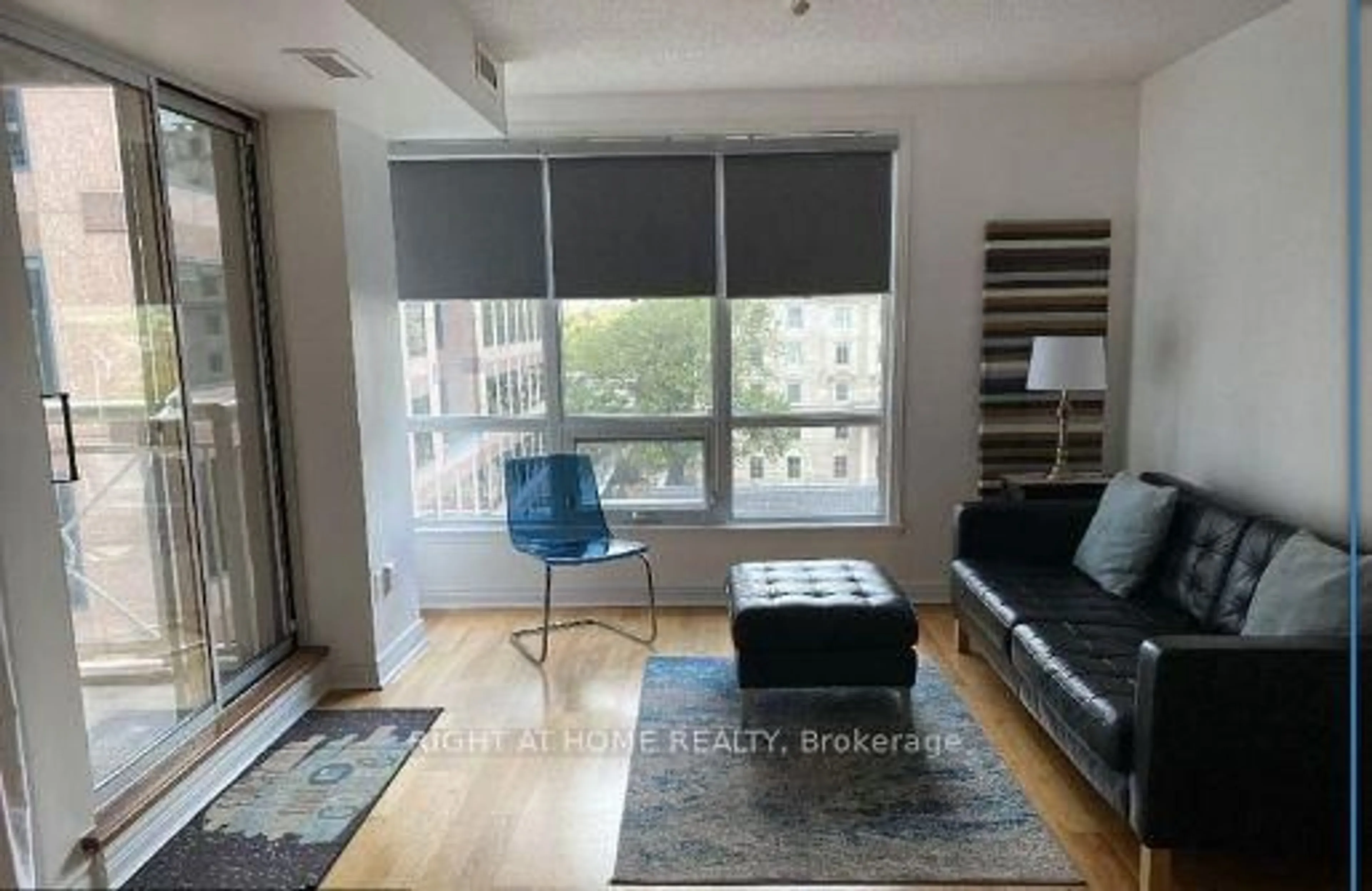 Living room with furniture, wood/laminate floor for 100 Hayden St #701, Toronto Ontario M4Y 3C7