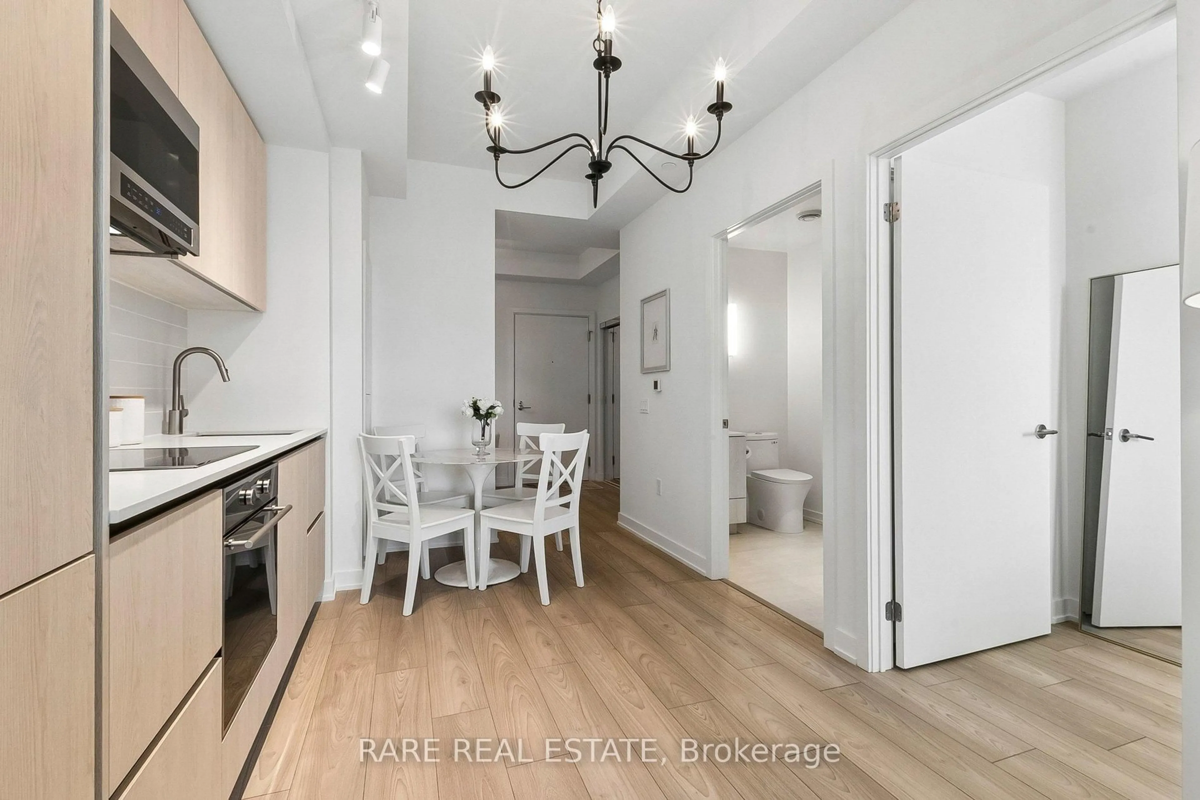 Open concept kitchen, wood/laminate floor for 110 Broadway Ave #2603, Toronto Ontario M4P 1V7
