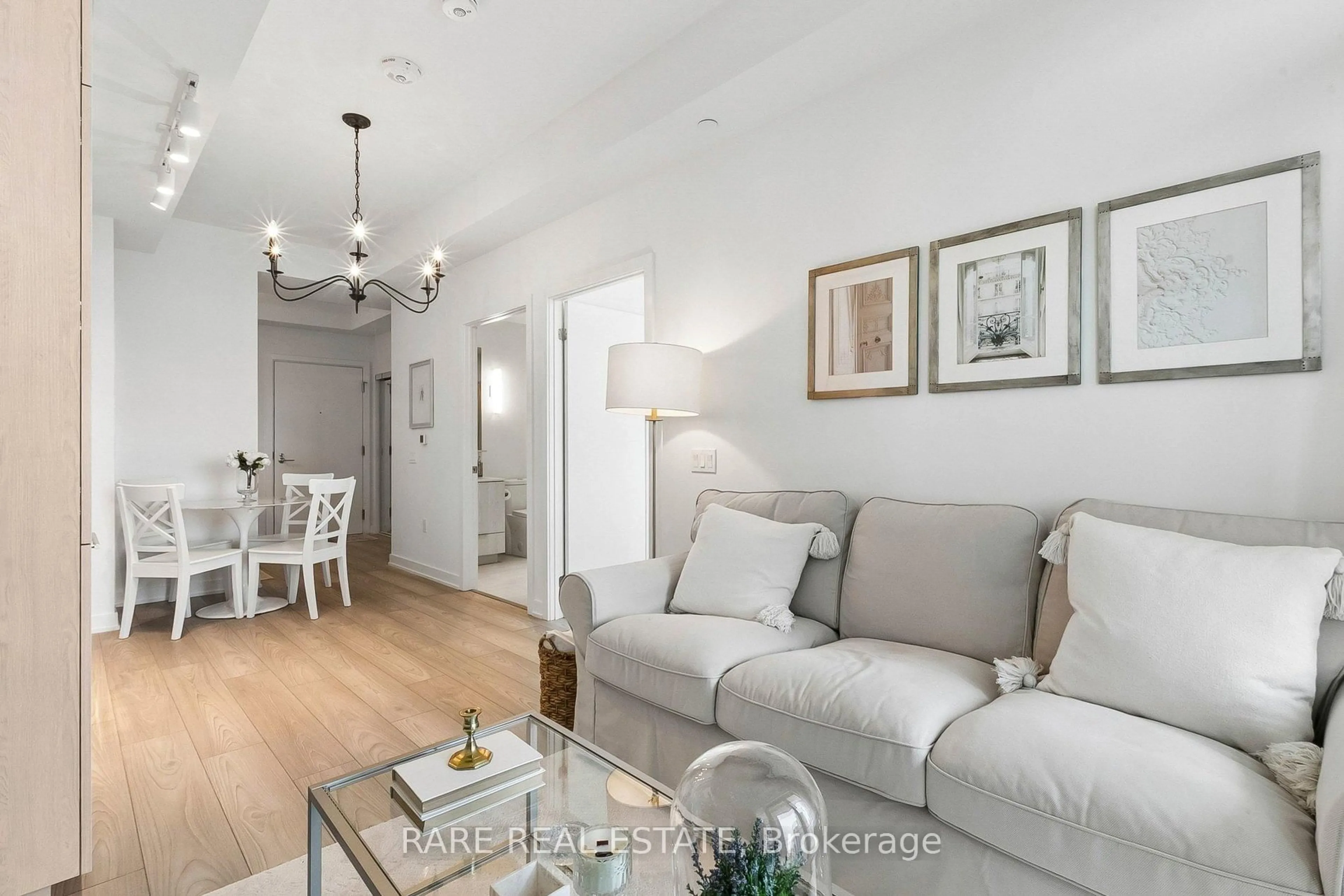 Living room with furniture, wood/laminate floor for 110 Broadway Ave #2603, Toronto Ontario M4P 1V7