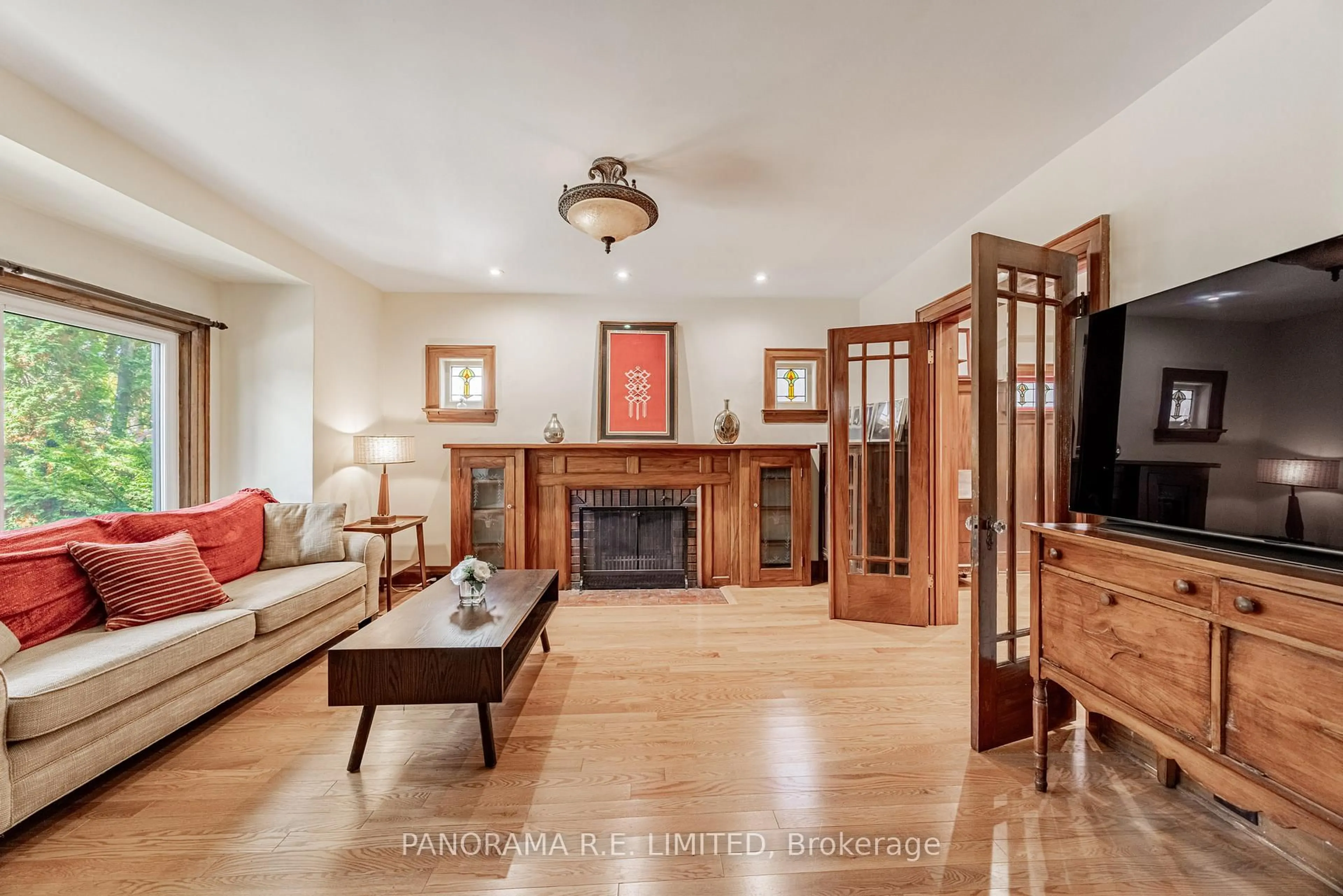 Living room with furniture, wood/laminate floor for 239 Winona Dr, Toronto Ontario M6C 3S5