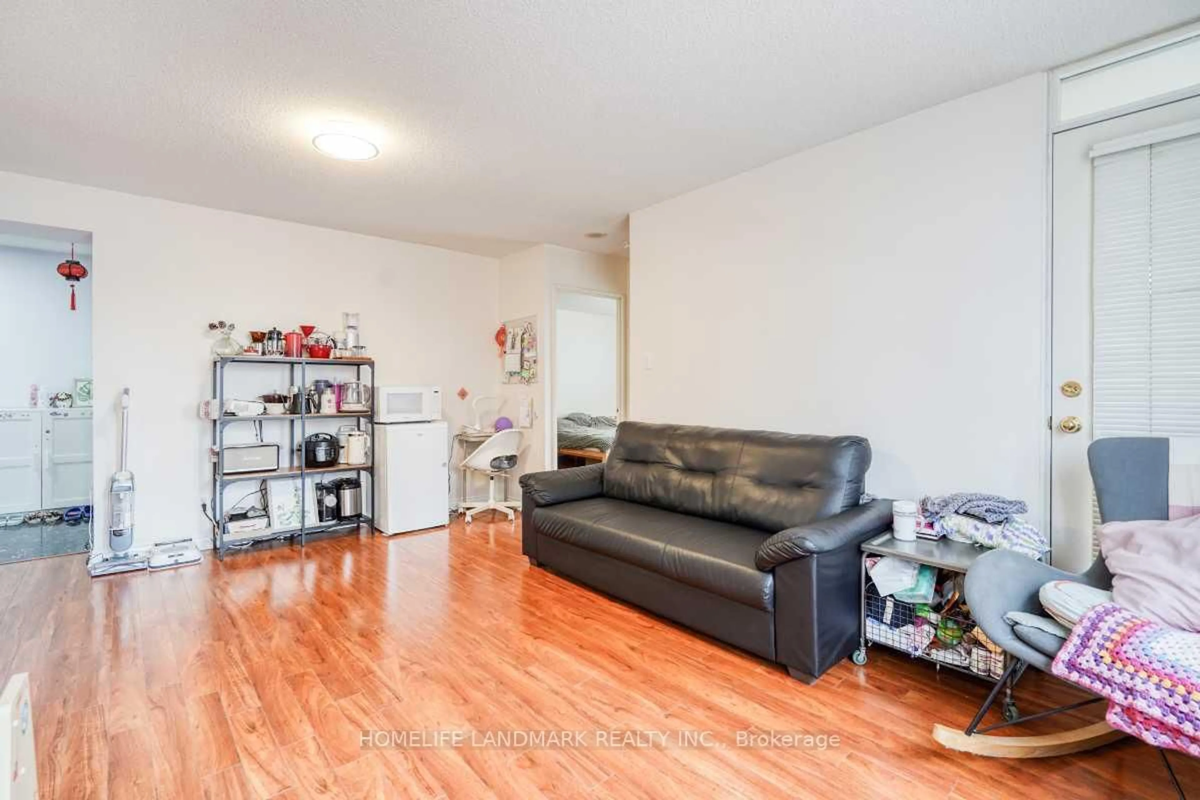 Living room with furniture, wood/laminate floor for 260 Doris Ave #302, Toronto Ontario M2N 6X9