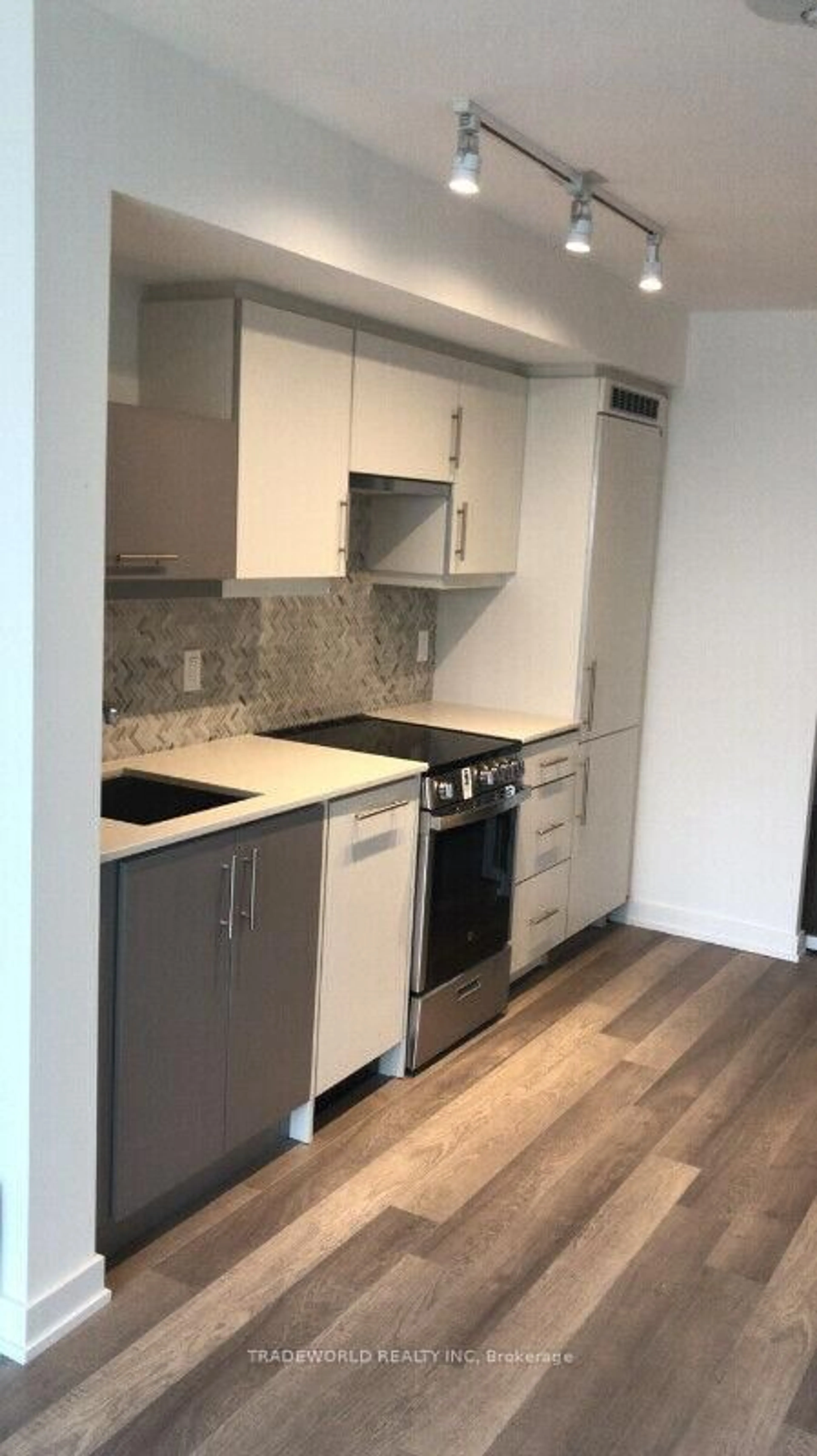 Standard kitchen, wood/laminate floor for 181 Huron St #707, Toronto Ontario M5T 0C1