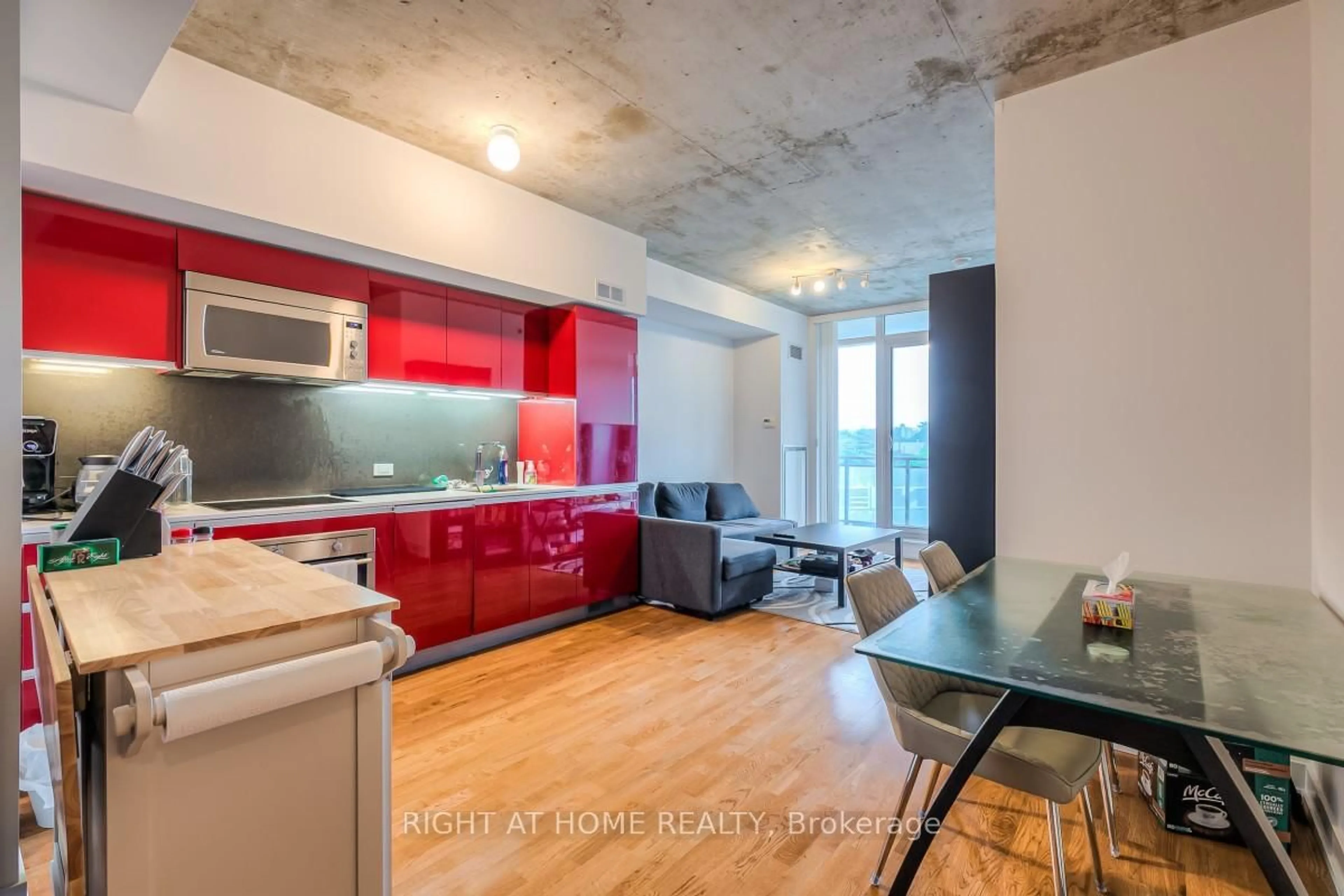 Open concept kitchen, cement floor for 20 Minowan Miikan Lane #419, Toronto Ontario M6J 0E5
