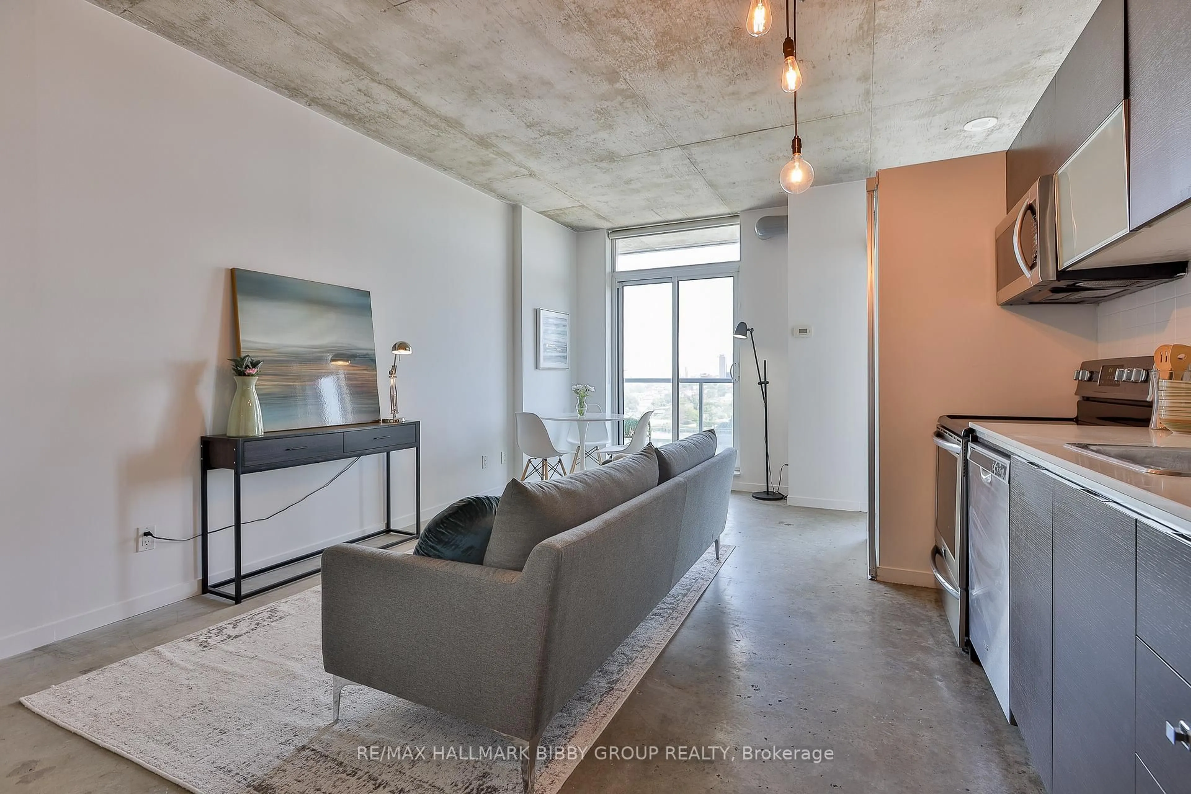 Living room with furniture, cement floor for 150 Sudbury St #1403, Toronto Ontario M6J 3S8