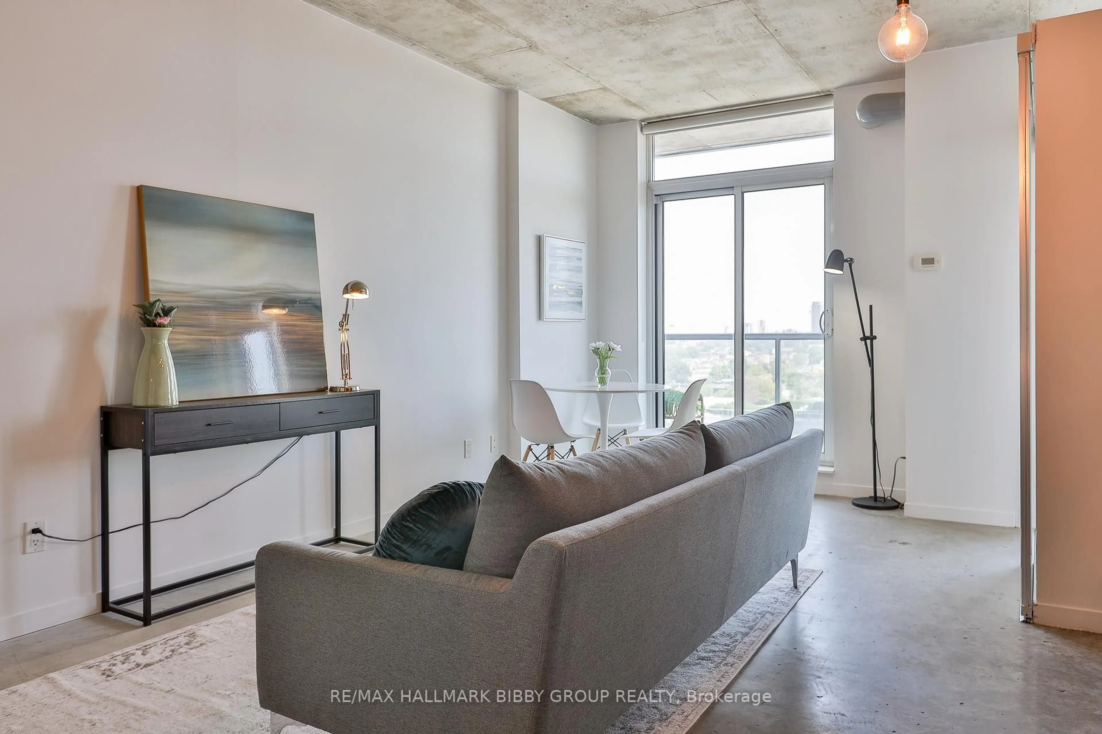 Living room with furniture, cement floor for 150 Sudbury St #1403, Toronto Ontario M6J 3S8