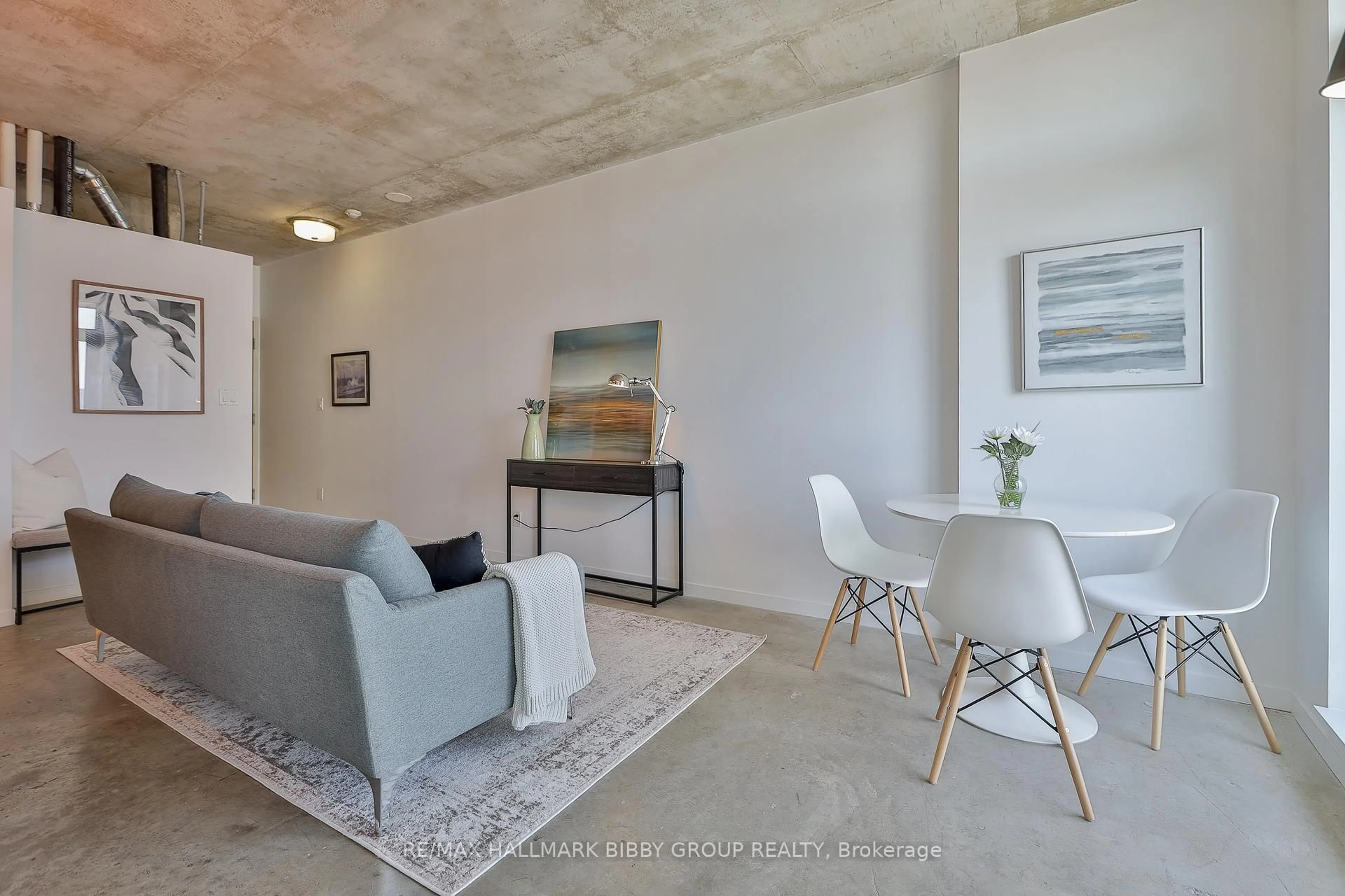 Living room with furniture, cement floor for 150 Sudbury St #1403, Toronto Ontario M6J 3S8