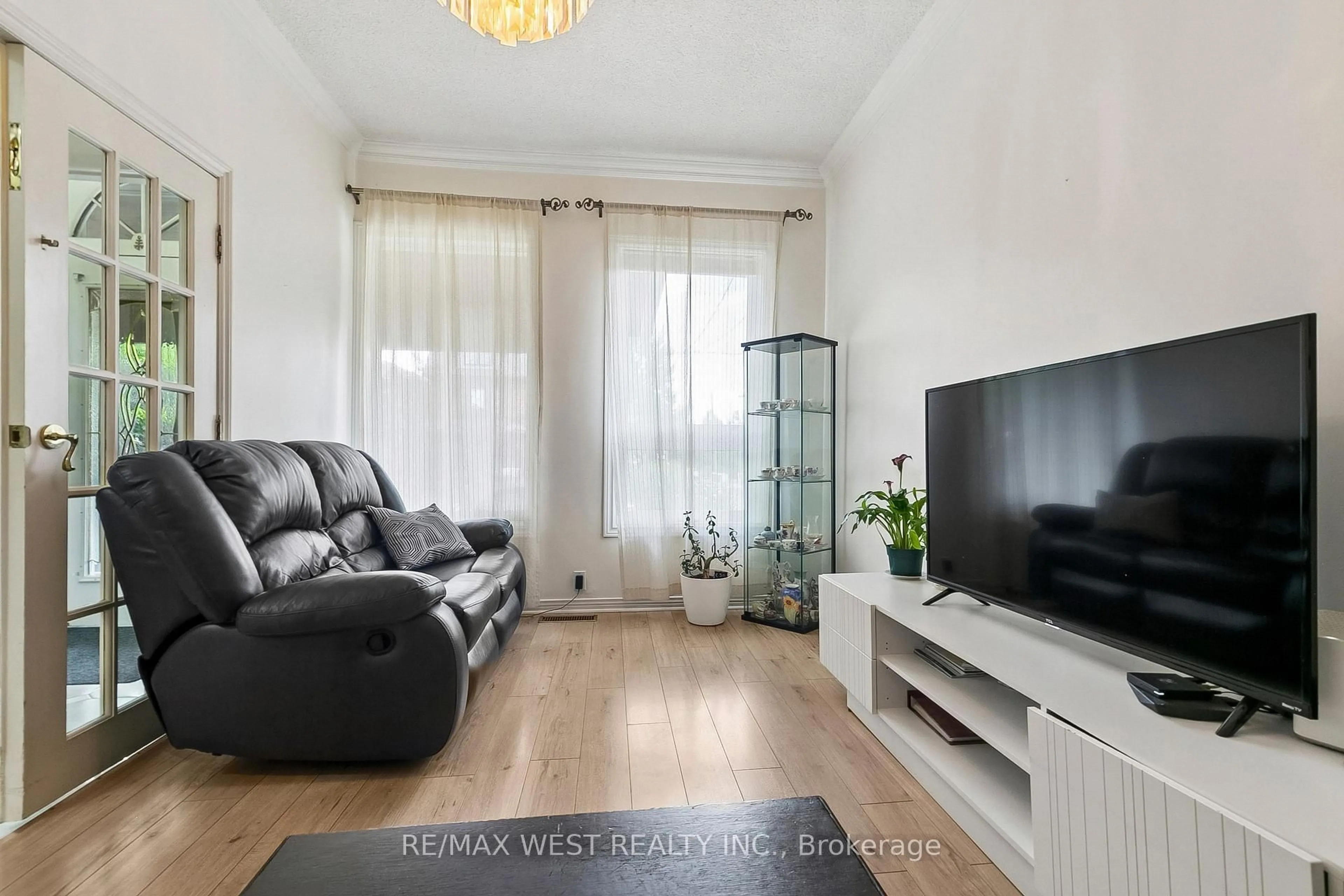 Living room with furniture, wood/laminate floor for 454 Brock Ave, Toronto Ontario M6H 3N3