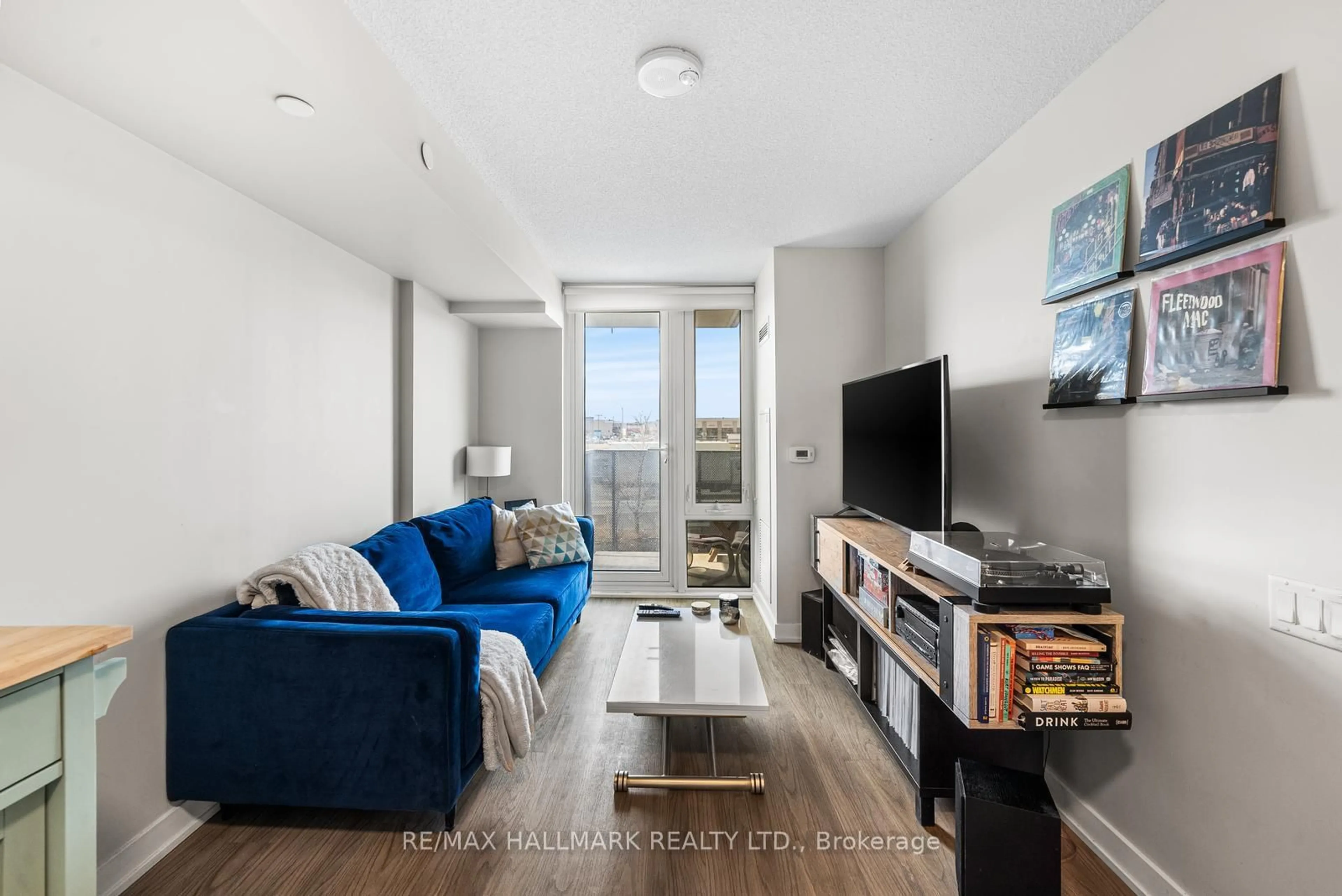 Living room with furniture, wood/laminate floor for 38 Monte Kwinter Crt #315, Toronto Ontario M3H 0E2