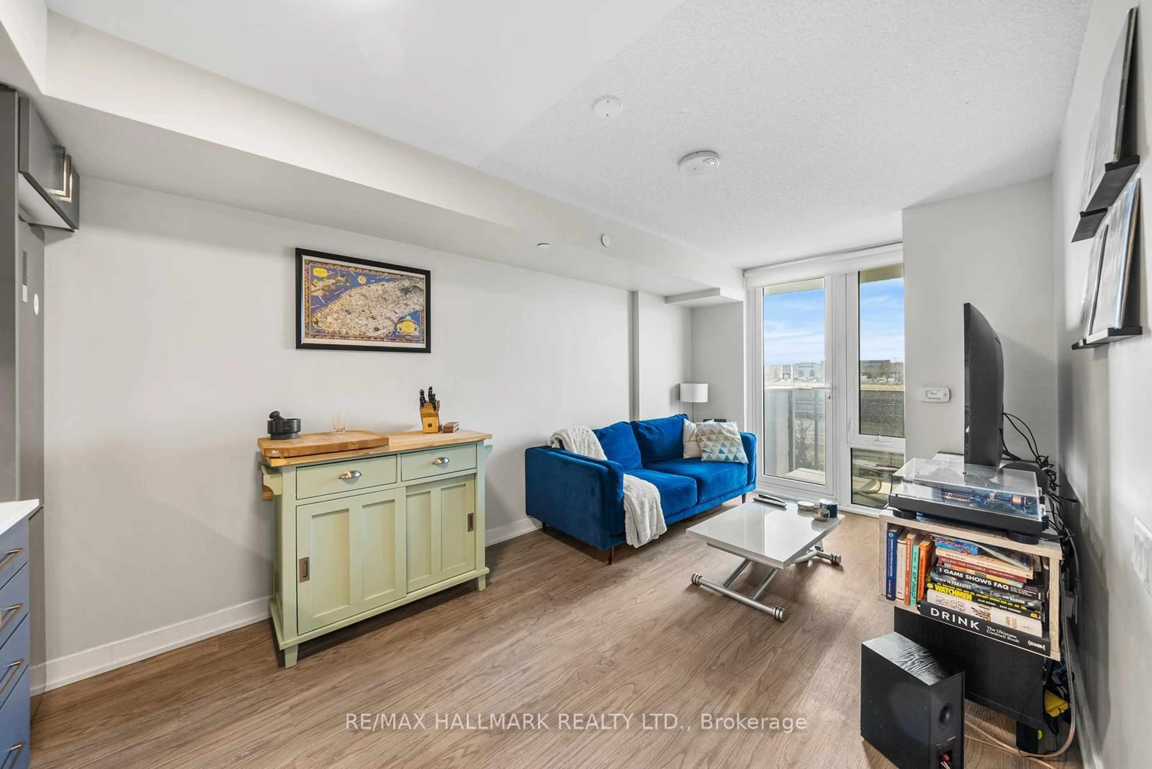 Living room with furniture, wood/laminate floor for 38 Monte Kwinter Crt #315, Toronto Ontario M3H 0E2