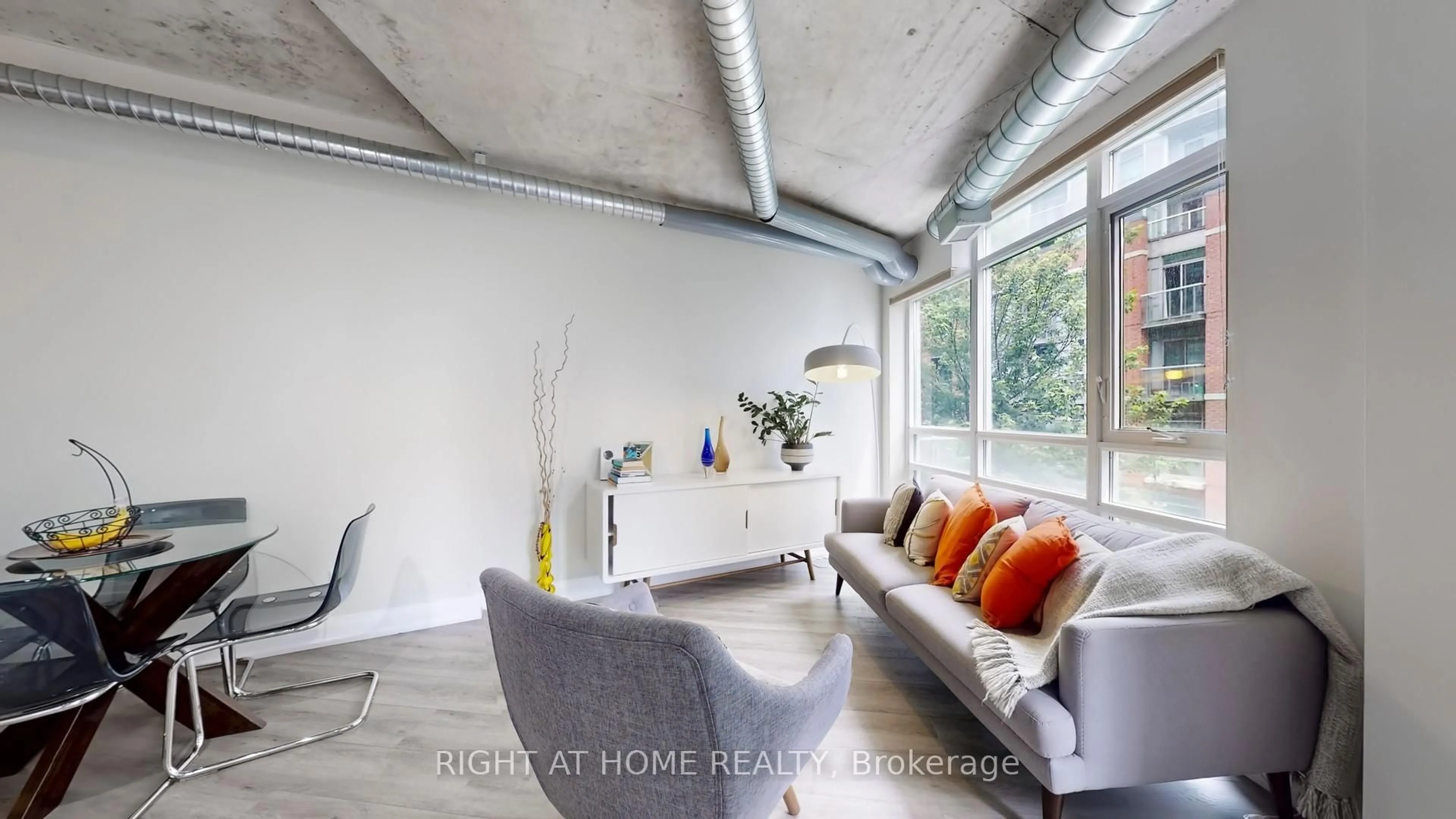 Living room with furniture, cement floor for 170 Sudbury St #415, Toronto Ontario M6J 0A1