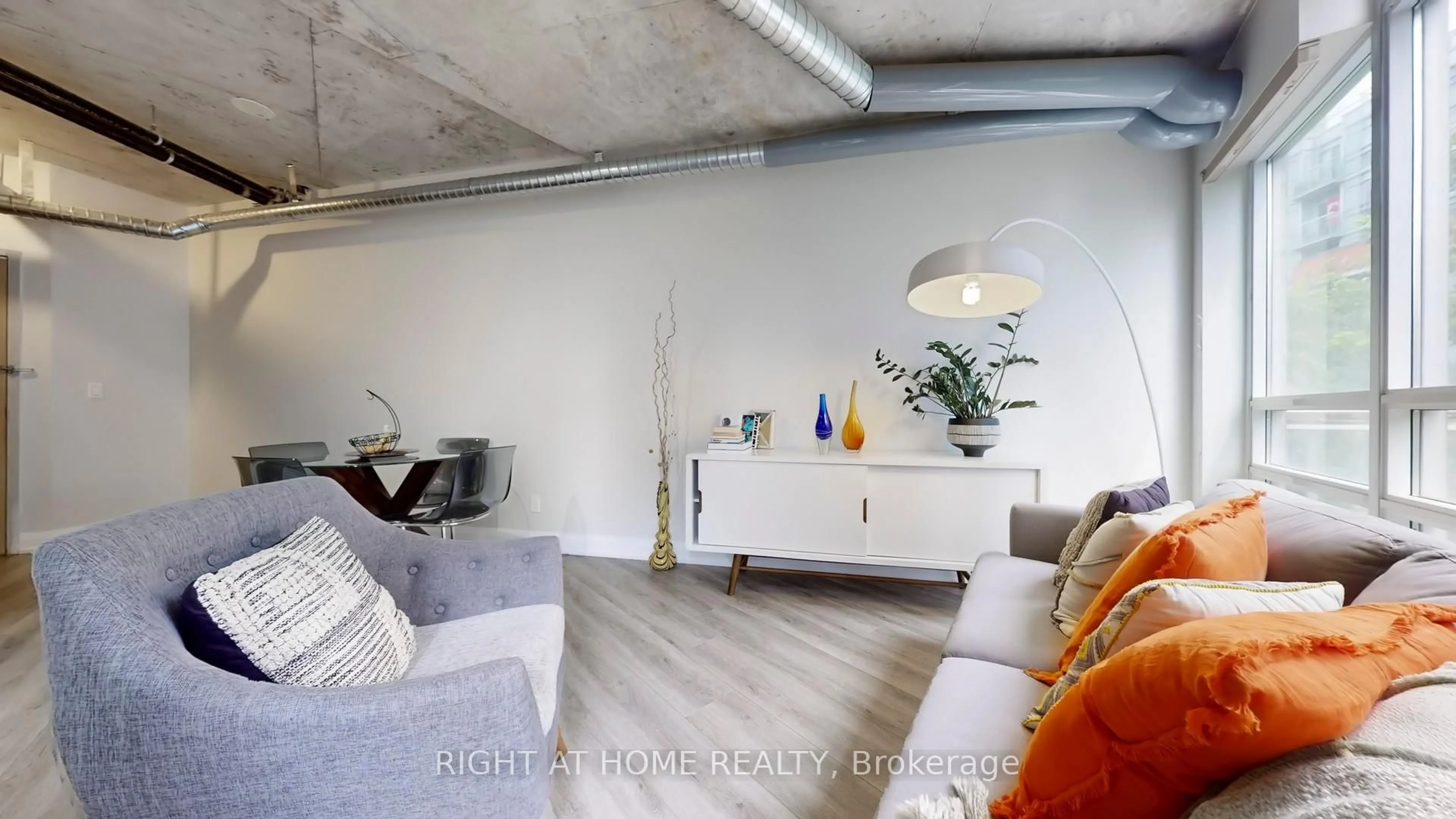 Living room with furniture, cement floor for 170 Sudbury St #415, Toronto Ontario M6J 0A1