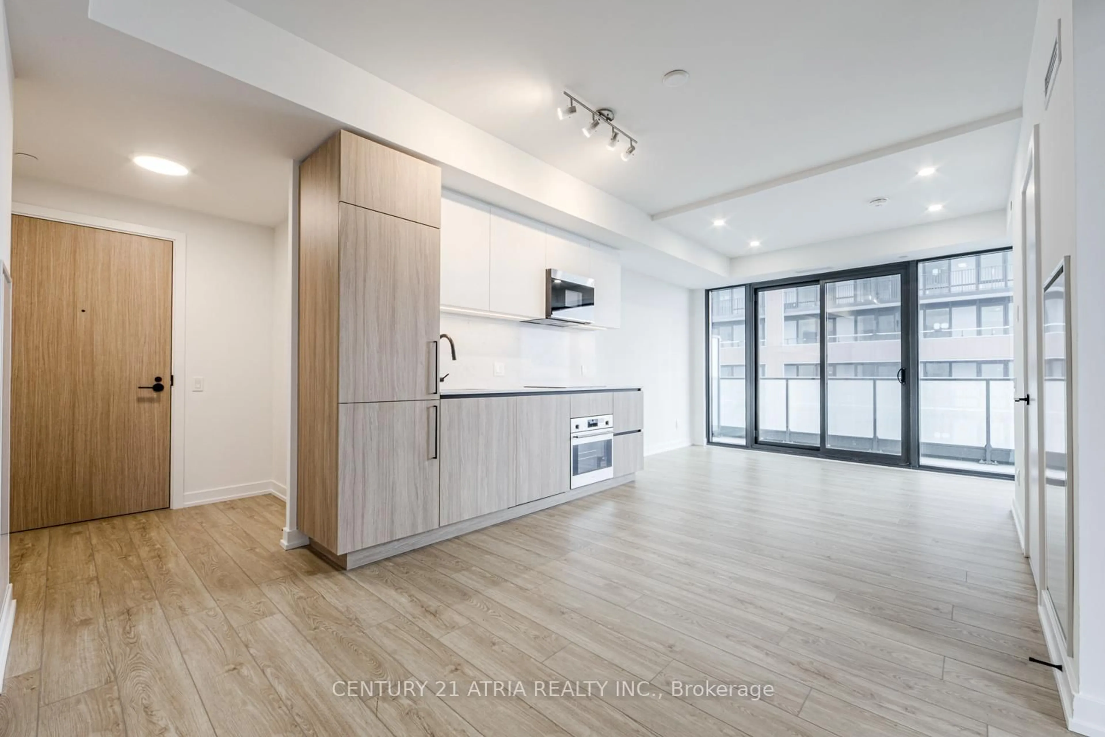 Open concept kitchen, wood/laminate floor for 35 Parliament St #1804, Toronto Ontario M5A 0Z5