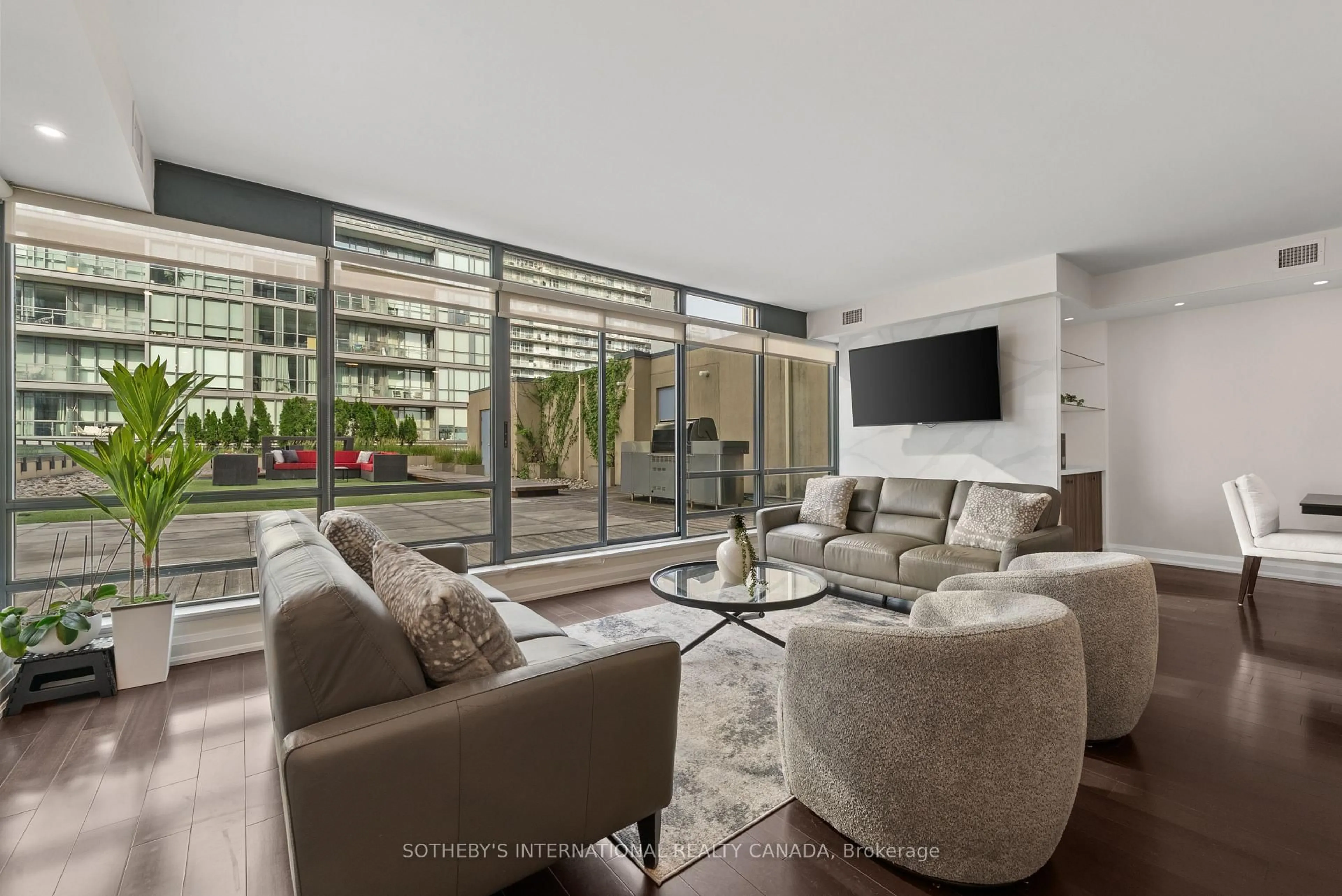 Living room with furniture, cement floor for 438 King St #1501, Toronto Ontario M5V 3T9