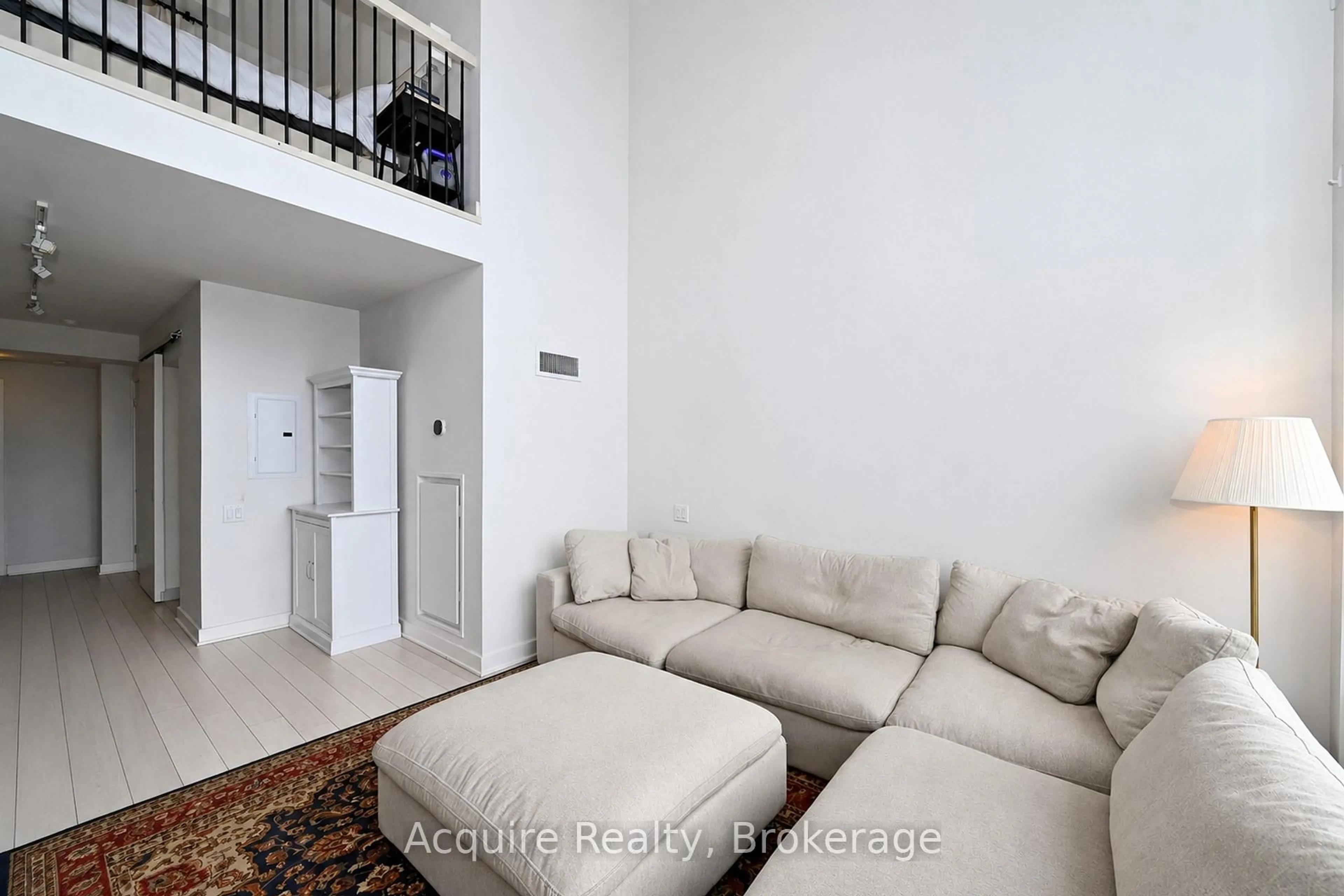Living room with furniture, floor is not visible for 5 Hanna Ave #413, Toronto Ontario M6K 1W8