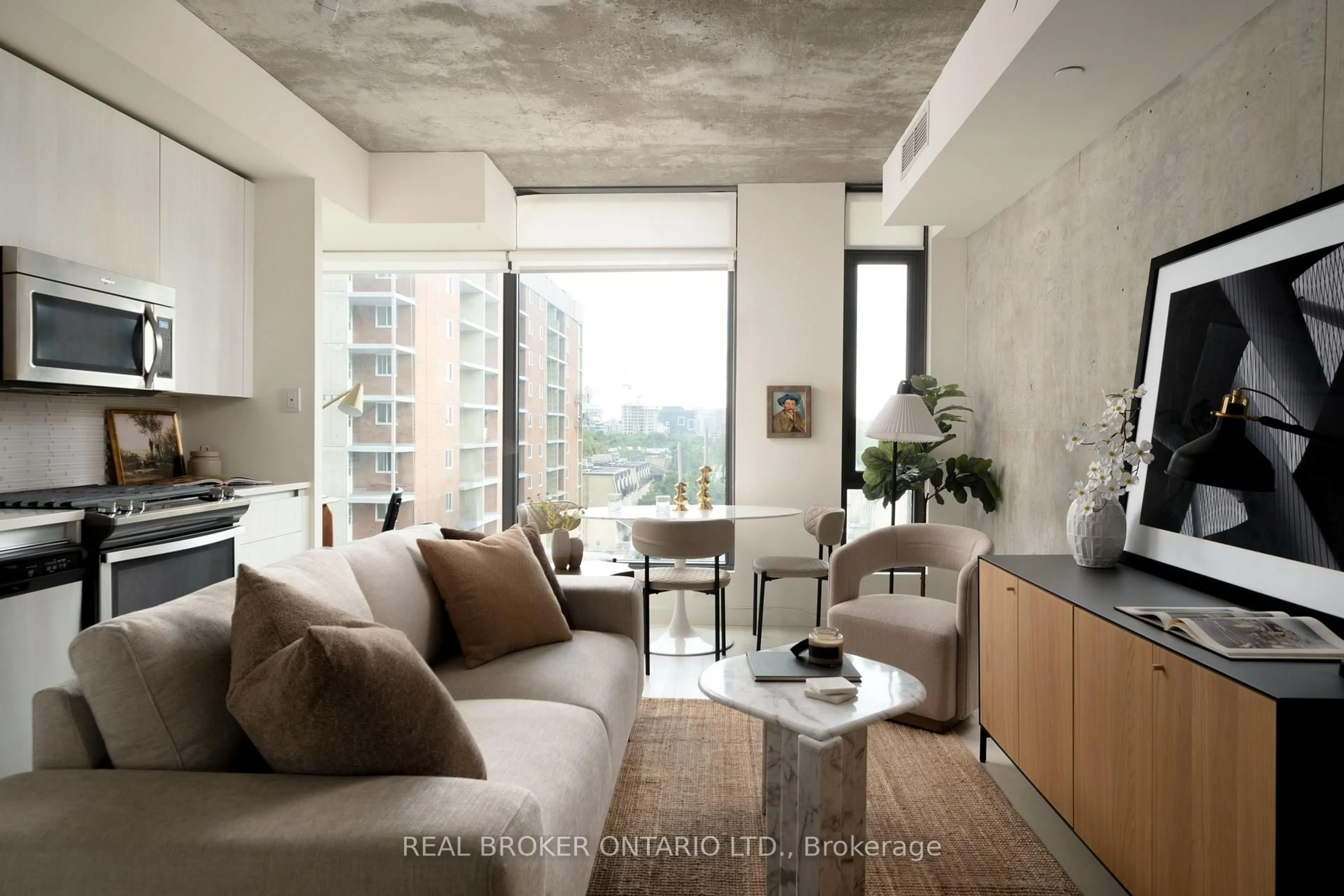 Living room with furniture, cement floor for 111 Bathurst St #508, Toronto Ontario M5V 0M9