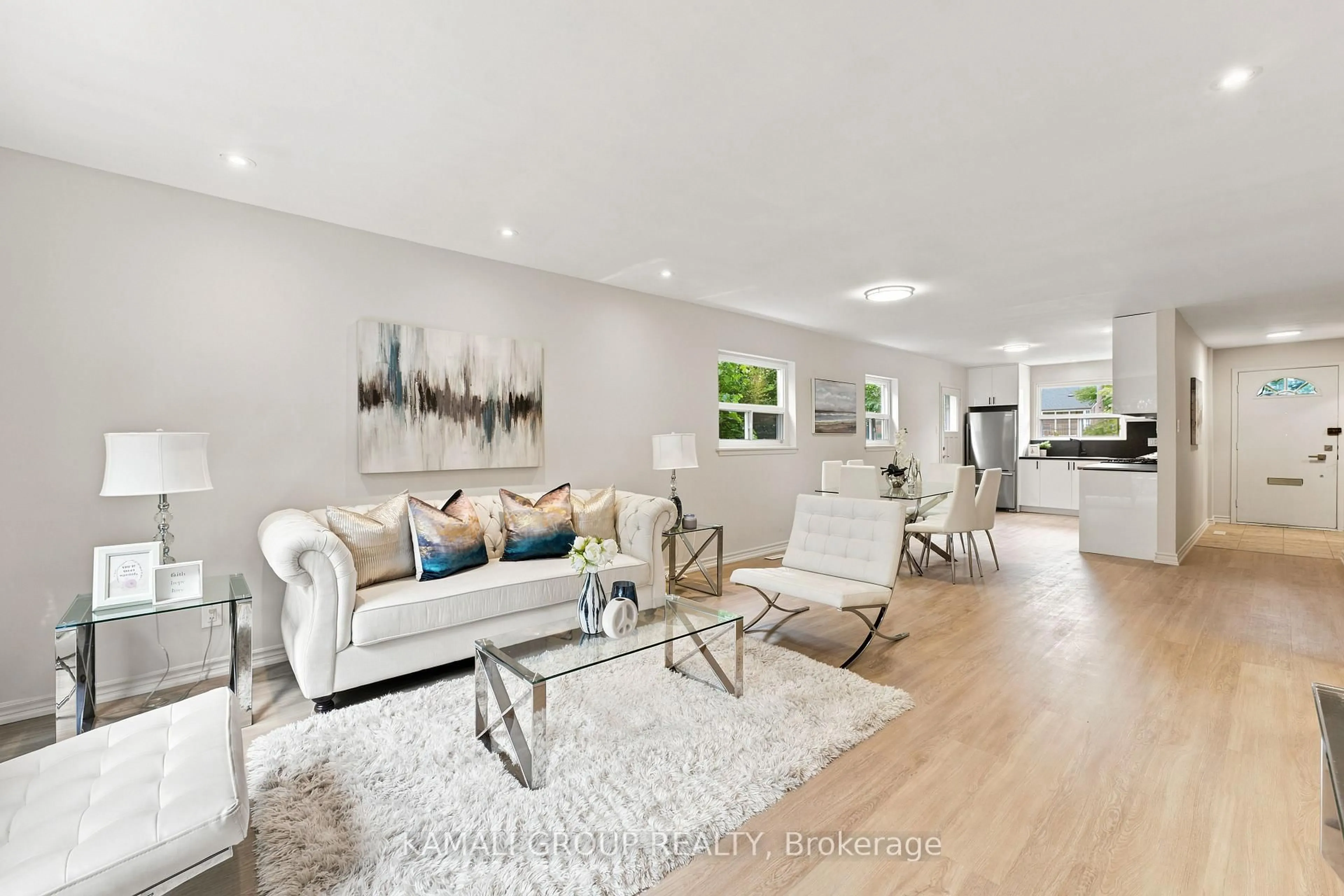 Living room with furniture, wood/laminate floor for 23 Greenwin Village Rd, Toronto Ontario M2R 2R9