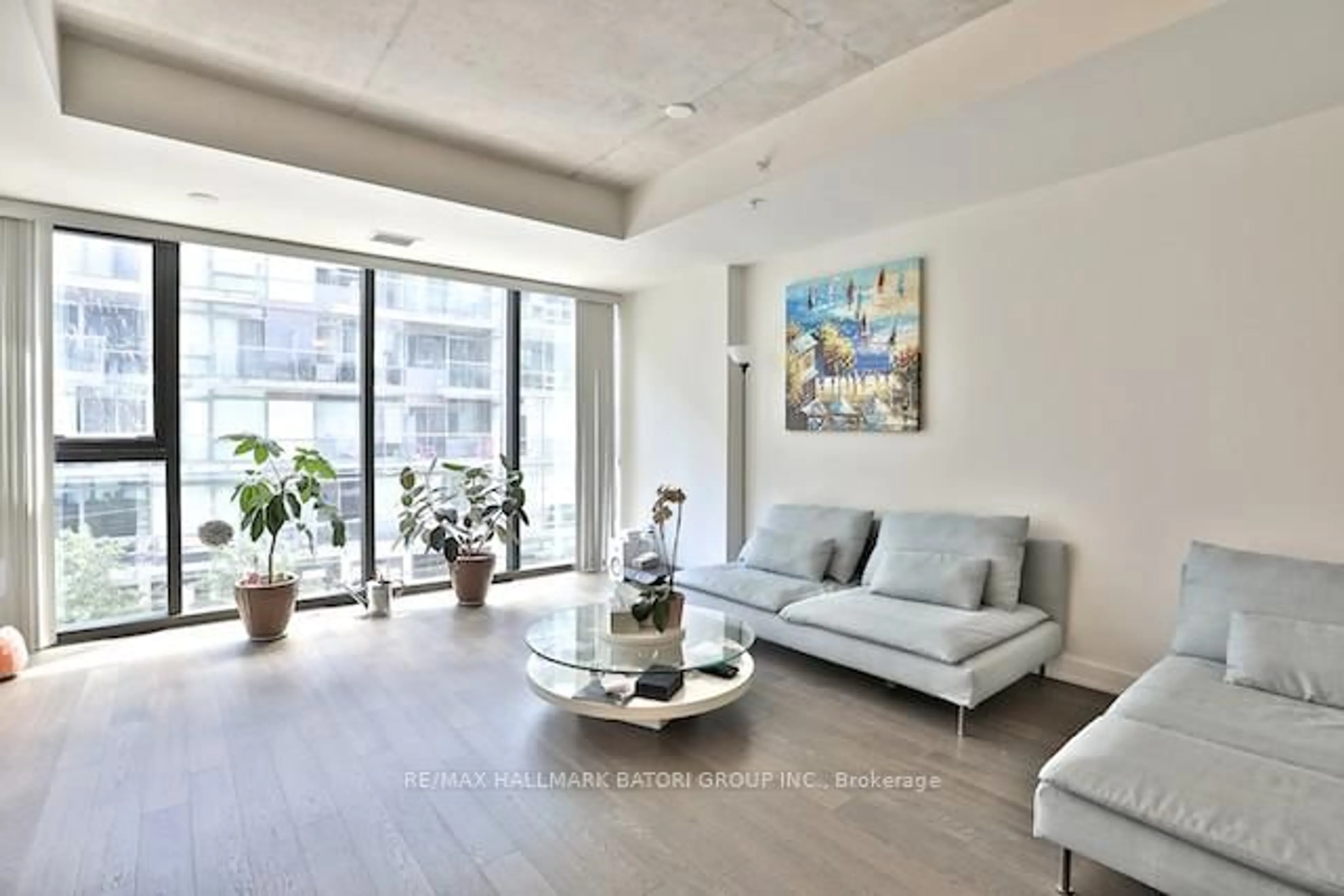 Living room with furniture, cement floor for 38 Stewart St #302, Toronto Ontario M5V 1H6
