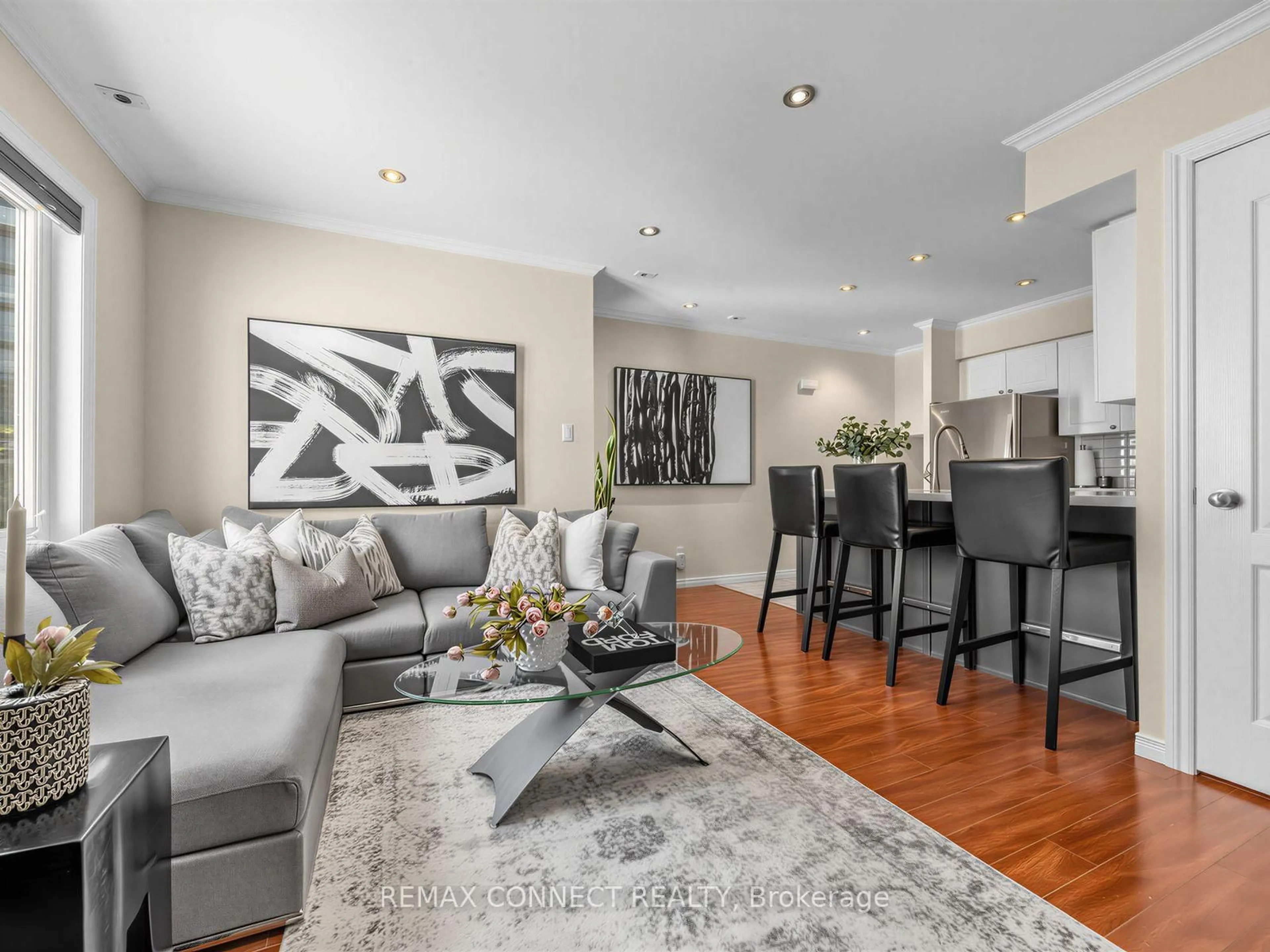 Living room with furniture, wood/laminate floor for 12 Sudbury St #605, Toronto Ontario M6J 3W7