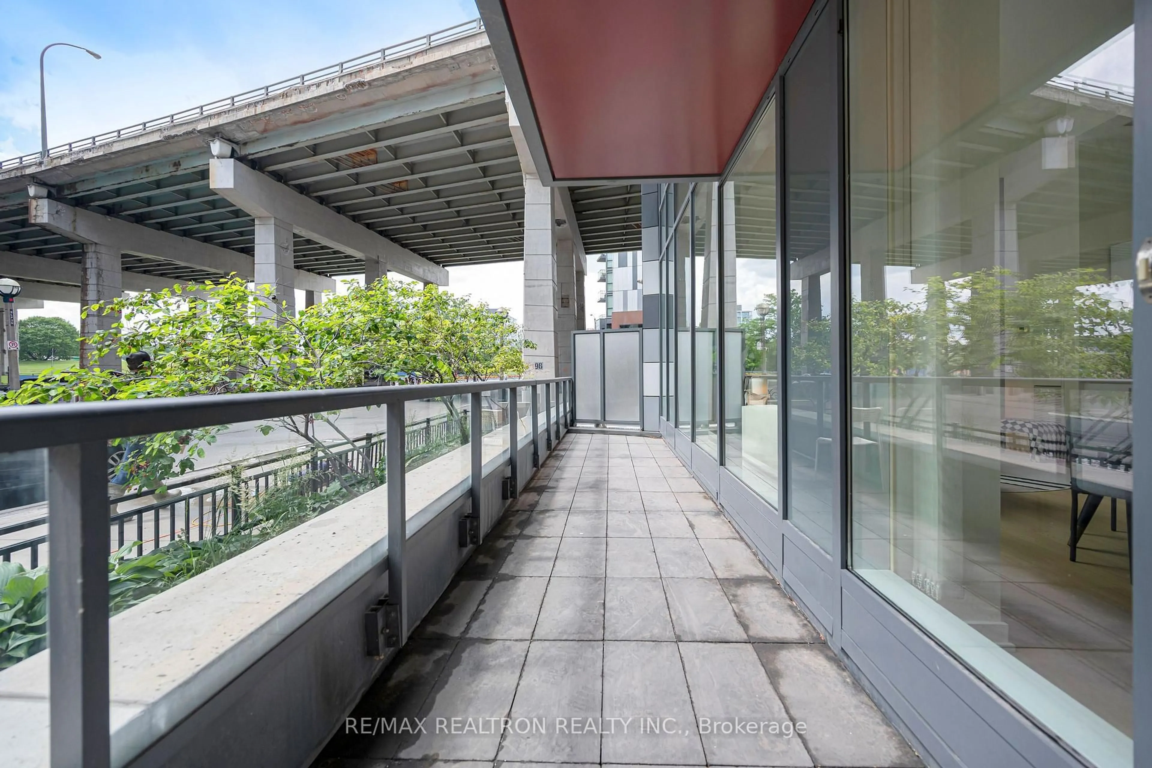 Patio, city buildings view from balcony for 20 Bruyeres Mews #TH12, Toronto Ontario M5V 0G8