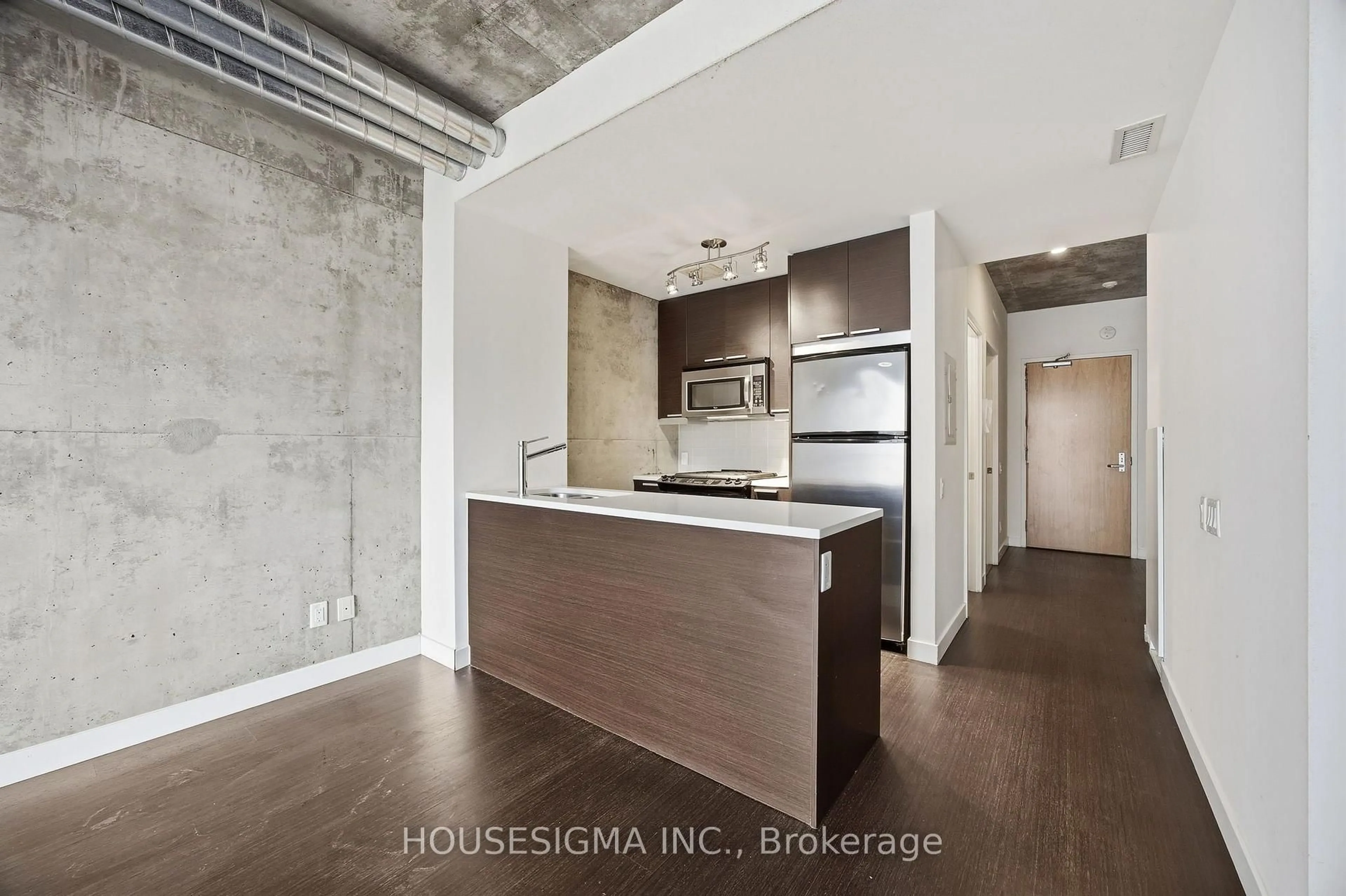 Open concept kitchen, cement floor for 138 Princess St #406, Toronto Ontario M5A 0B1